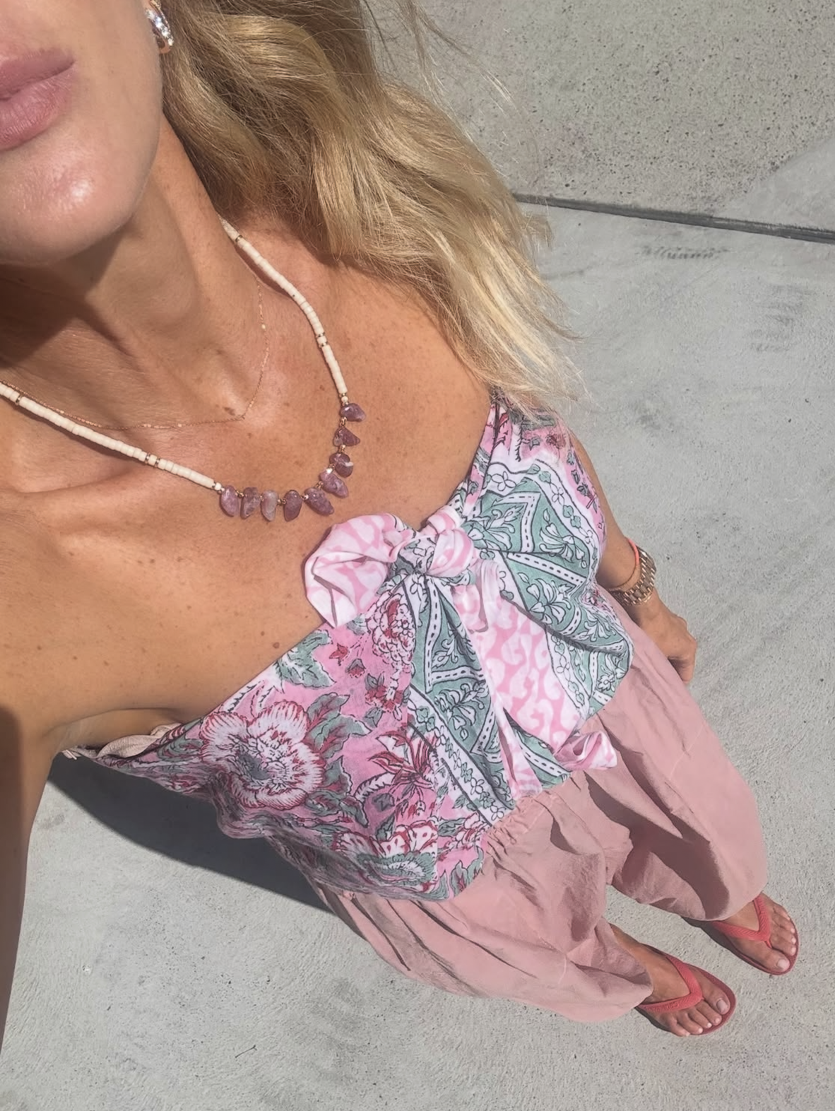 Natalie Jacobson styled in Tunik Atelier Nomade jewellery, layered necklaces with natural stone pendants