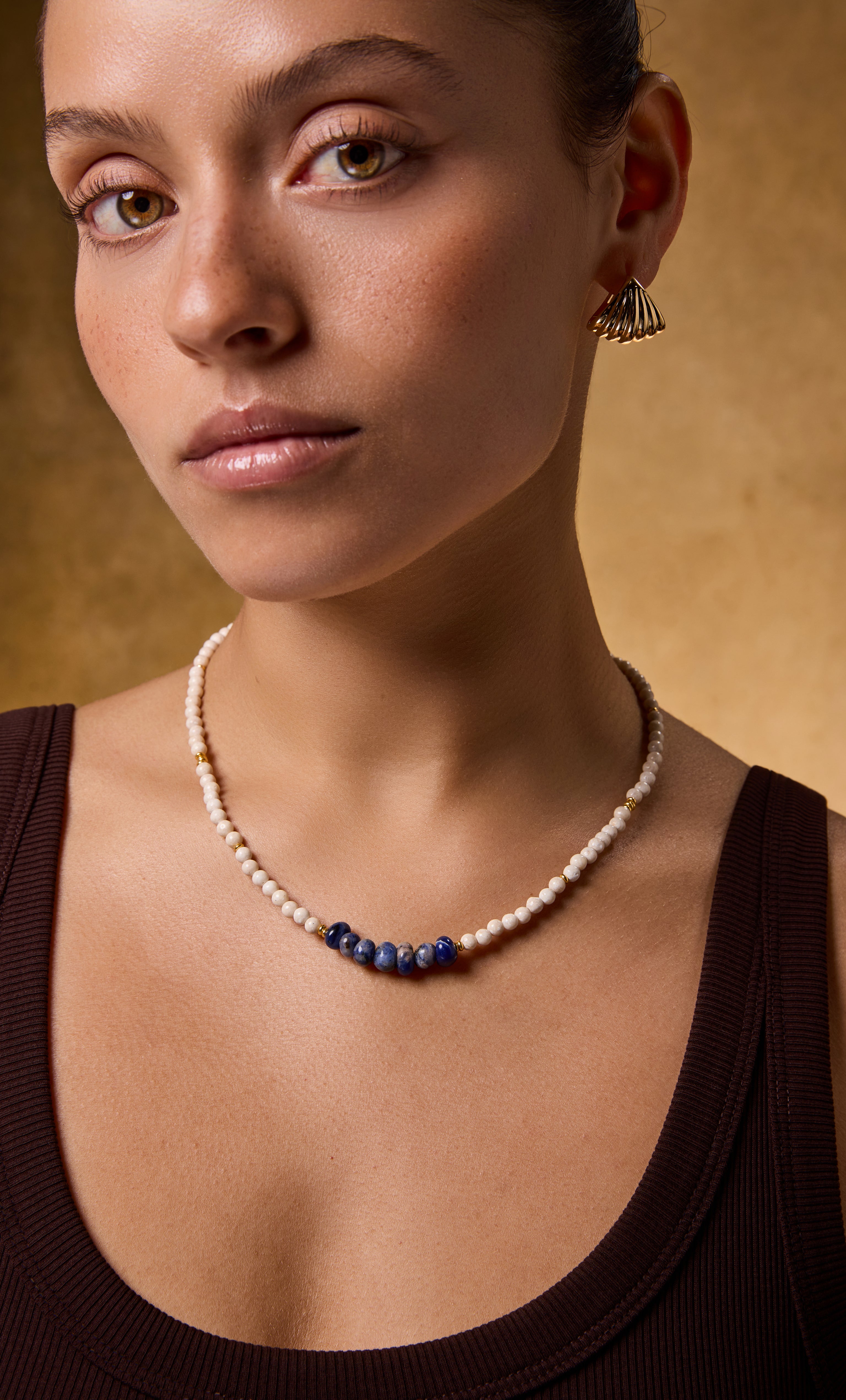 Handmade Tunik gold fill necklace with blue sodalite and fossil stone beads, stylish jewellery gift.