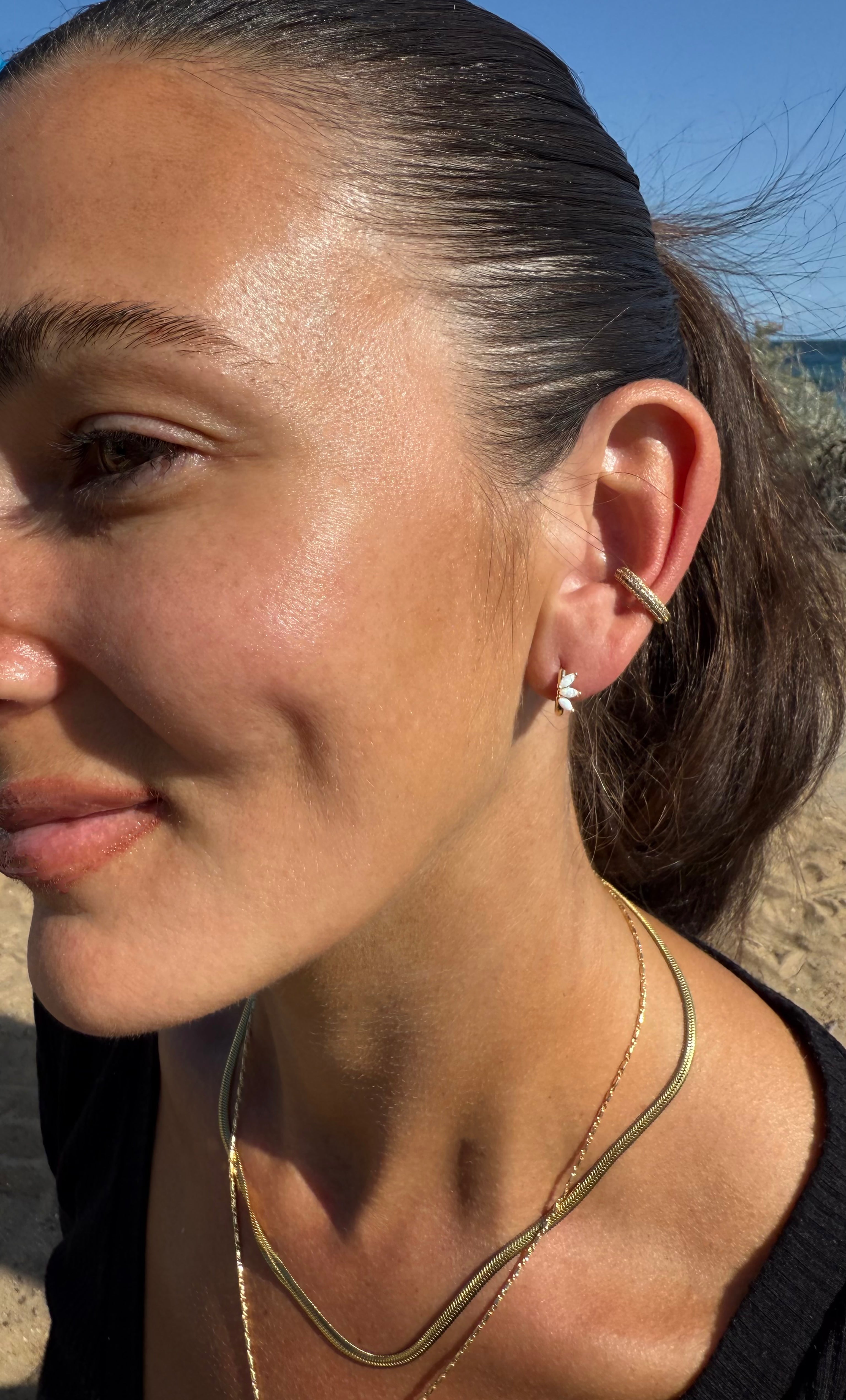The Tunik White Opal Lumino Huggie Earrings