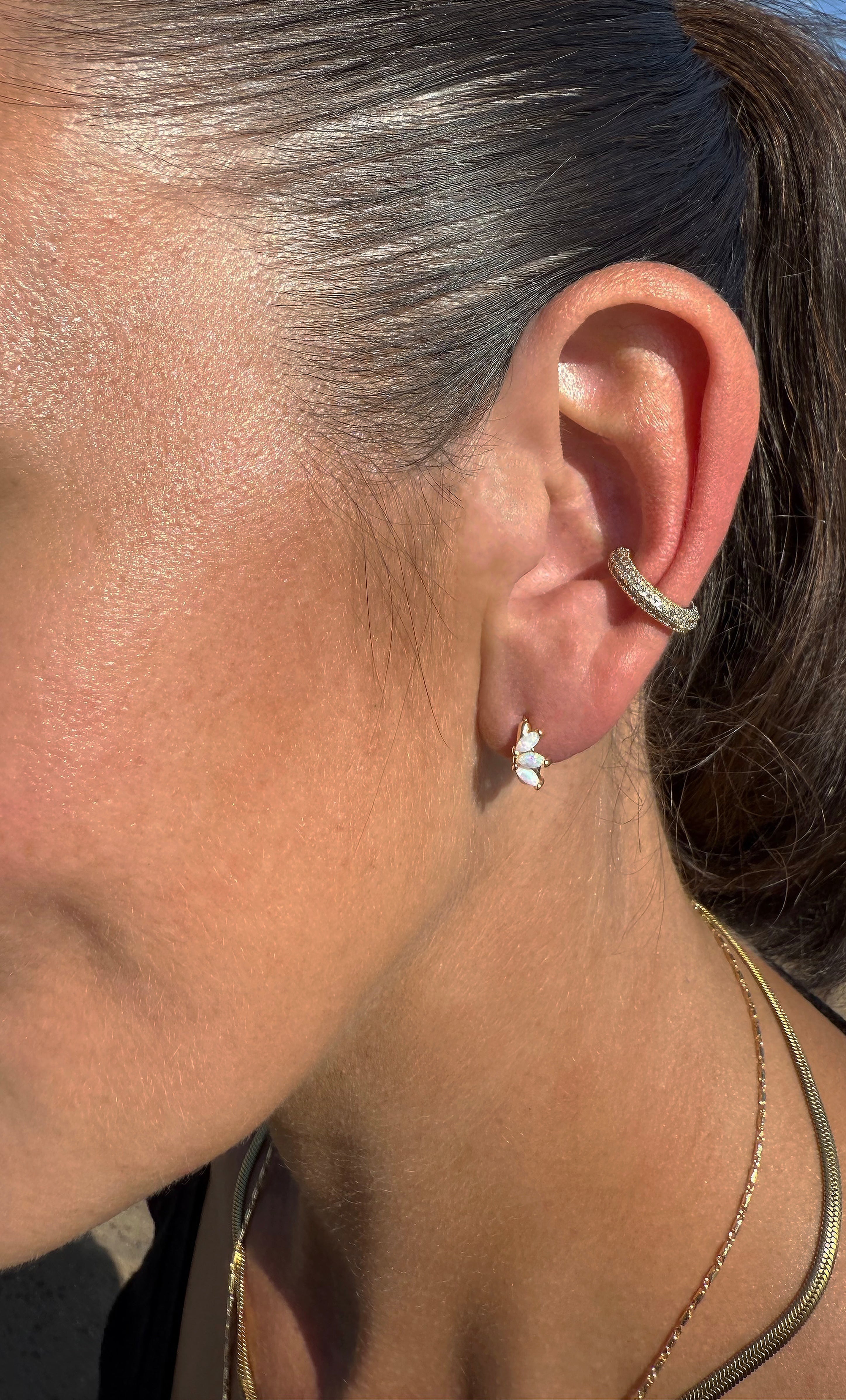 The Tunik White Opal Lumino Huggie Earrings