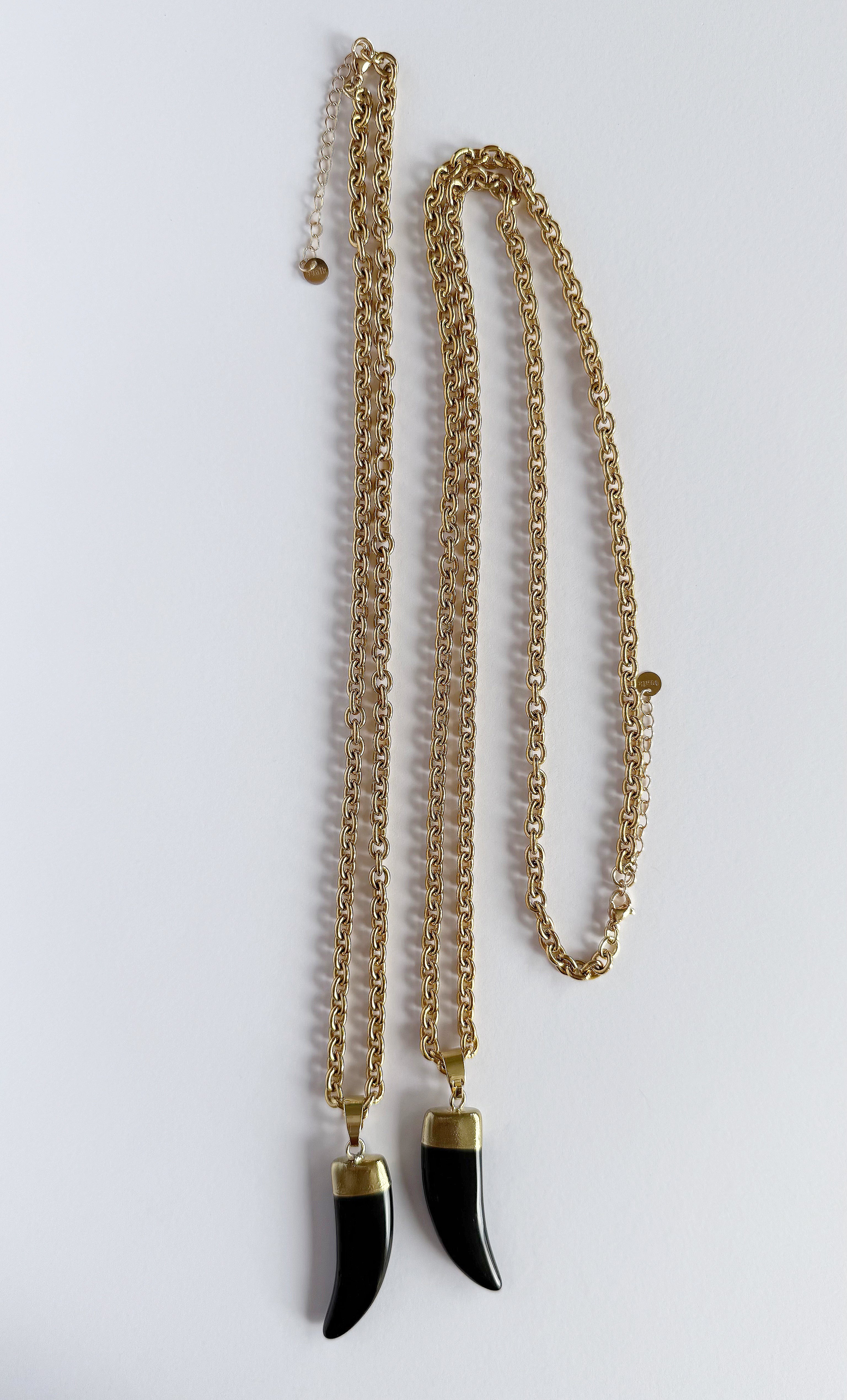 Gold fill necklace by Tunik featuring carved agate horn pendants, long and short length options.