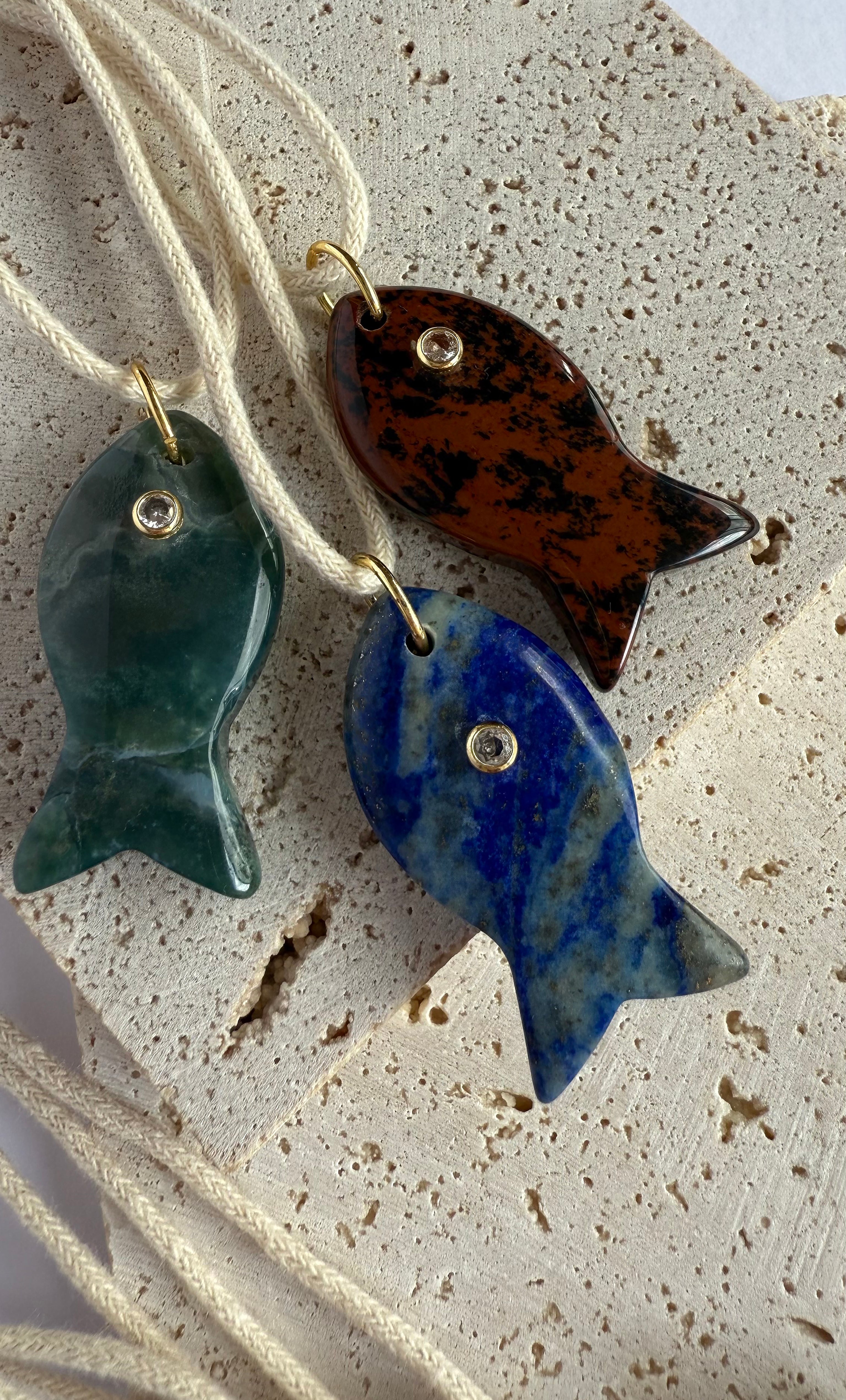 Tunik gold fill necklaces with carved green, blue, and brown fish pendants, unique jewellery gifts.