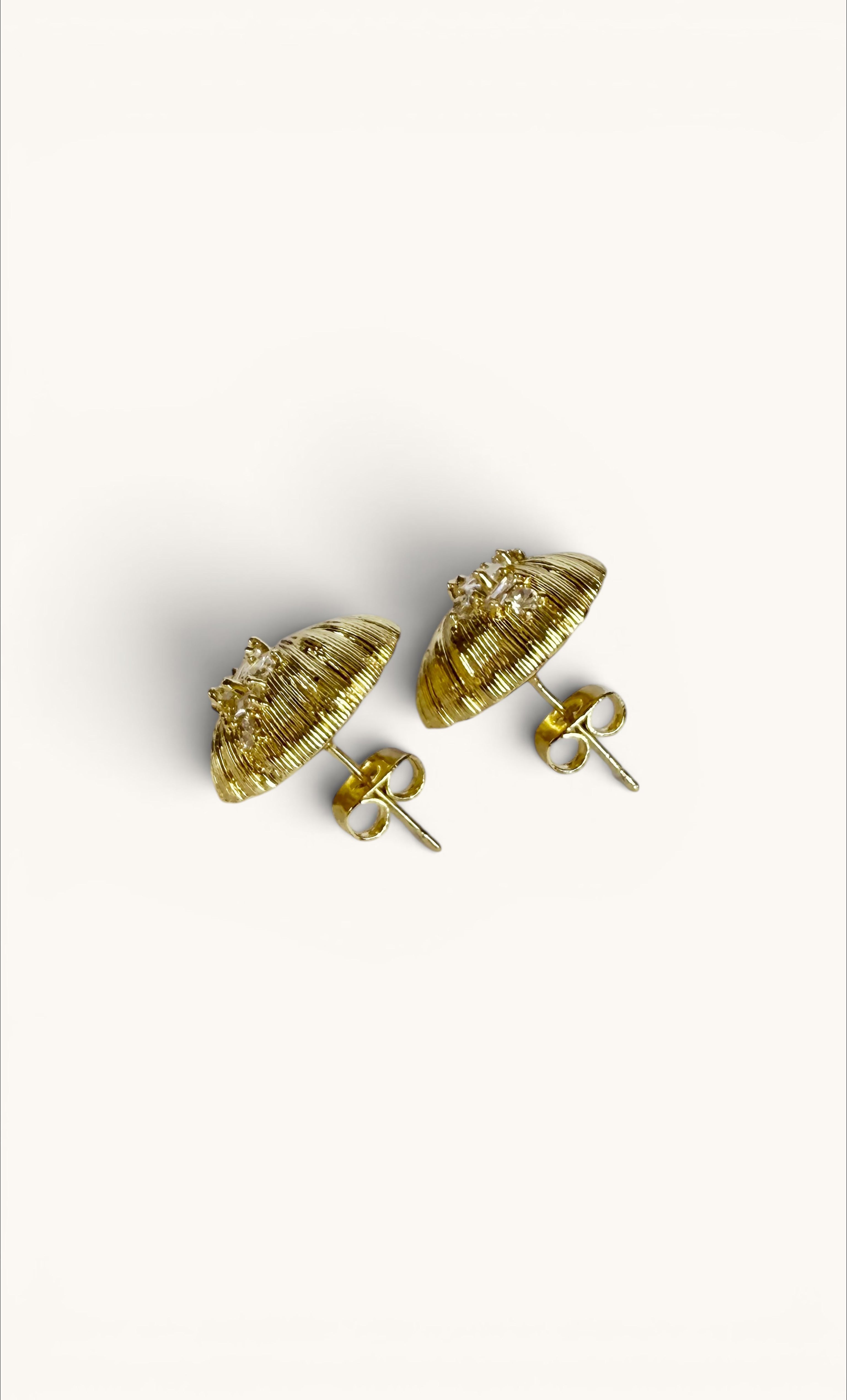 14K gold fill seashell-shaped stud earrings with clear zirconia accents and butterfly backs.