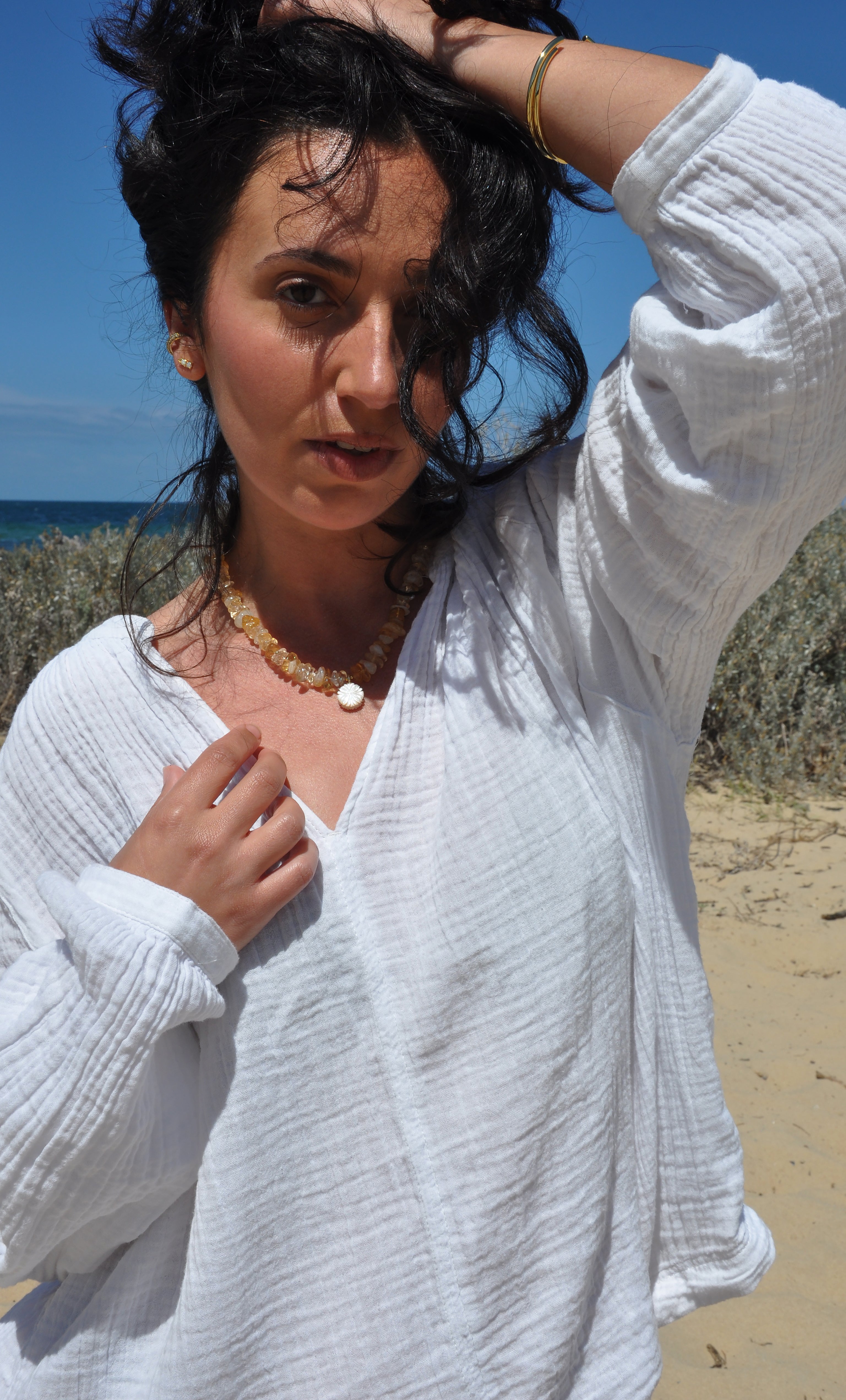 Gold fill Desert Bloom yellow citrine stone necklace with flower carved pendant by Tunik the label.