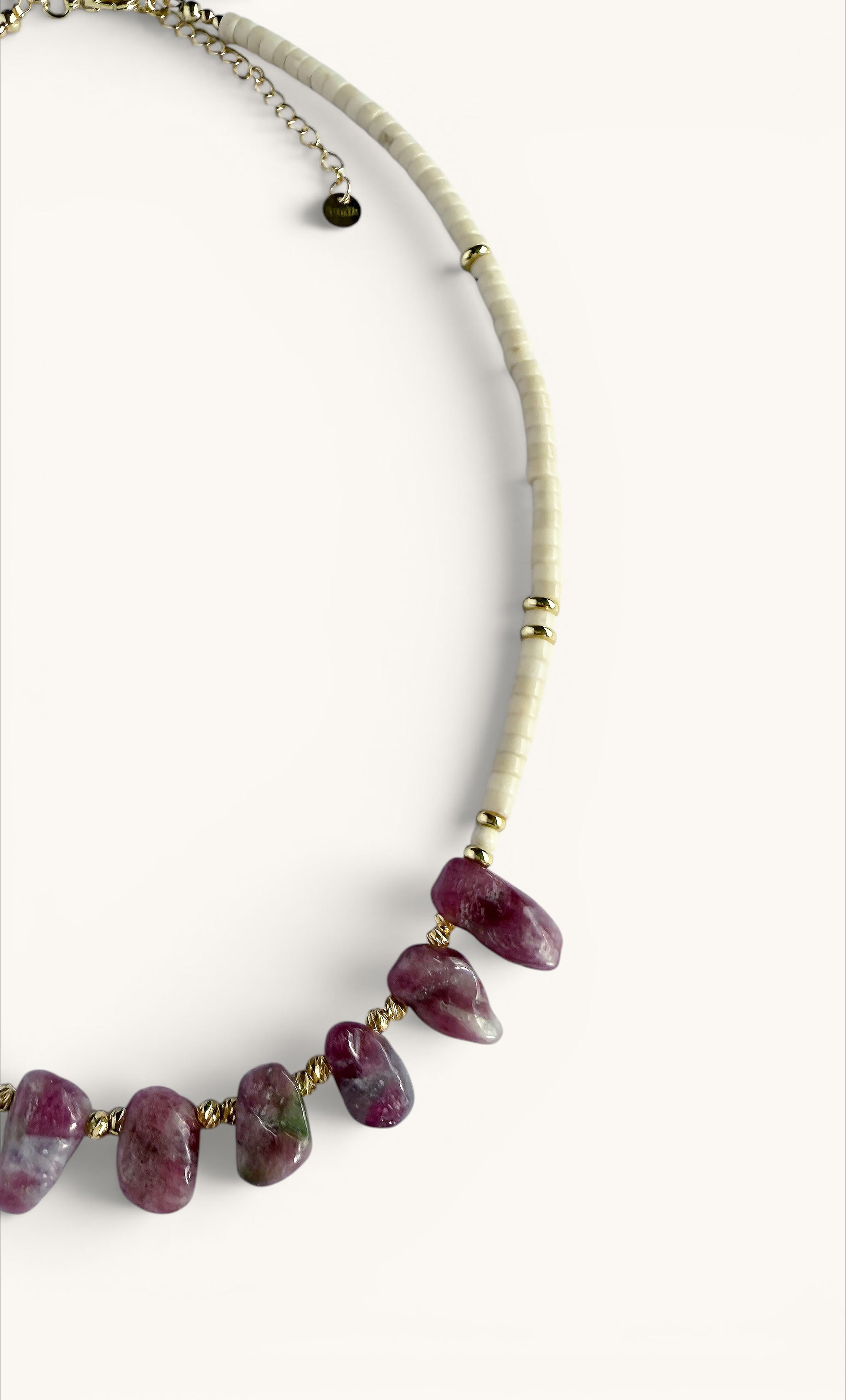 Handmade beaded necklace with irregular pink tourmaline stones and small ivory jasper beads on a gold-filled chain.