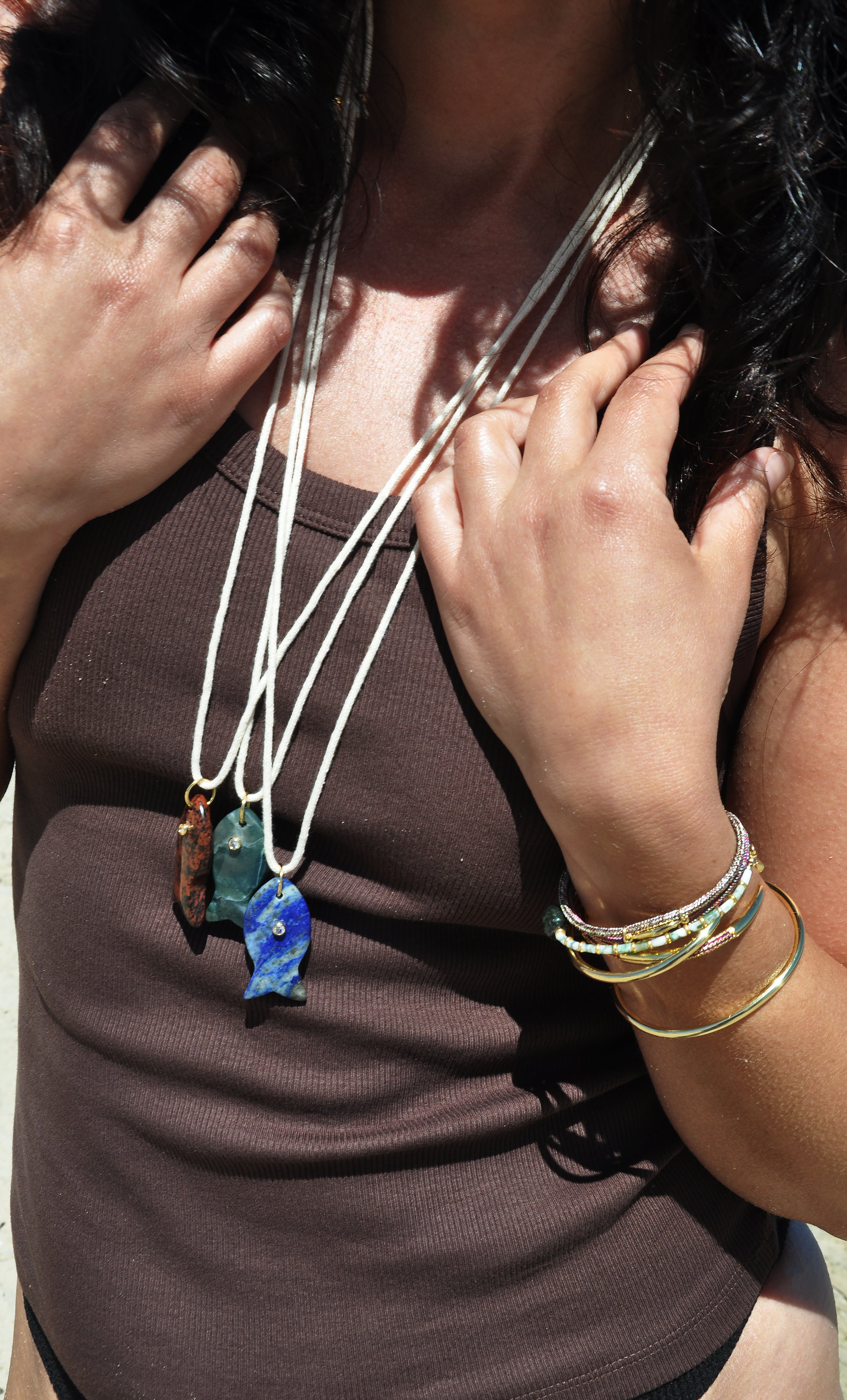 Tunik gold fill necklace with carved green apatite fish pendant on layered chains, stylish jewellery gifts.