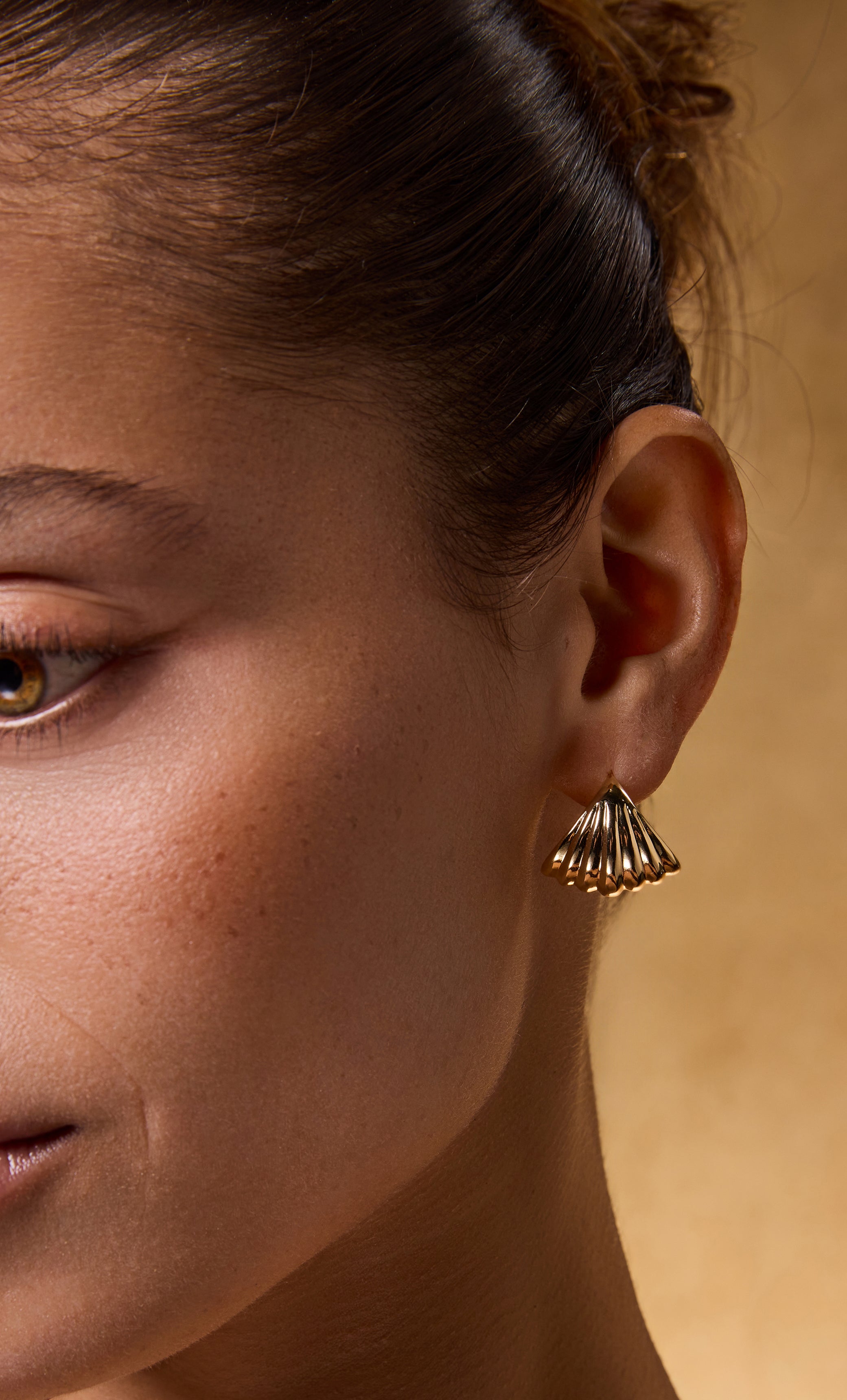 Tunik gold fill huggie earrings with sculpted shell design, elegant jewellery gift accessory.