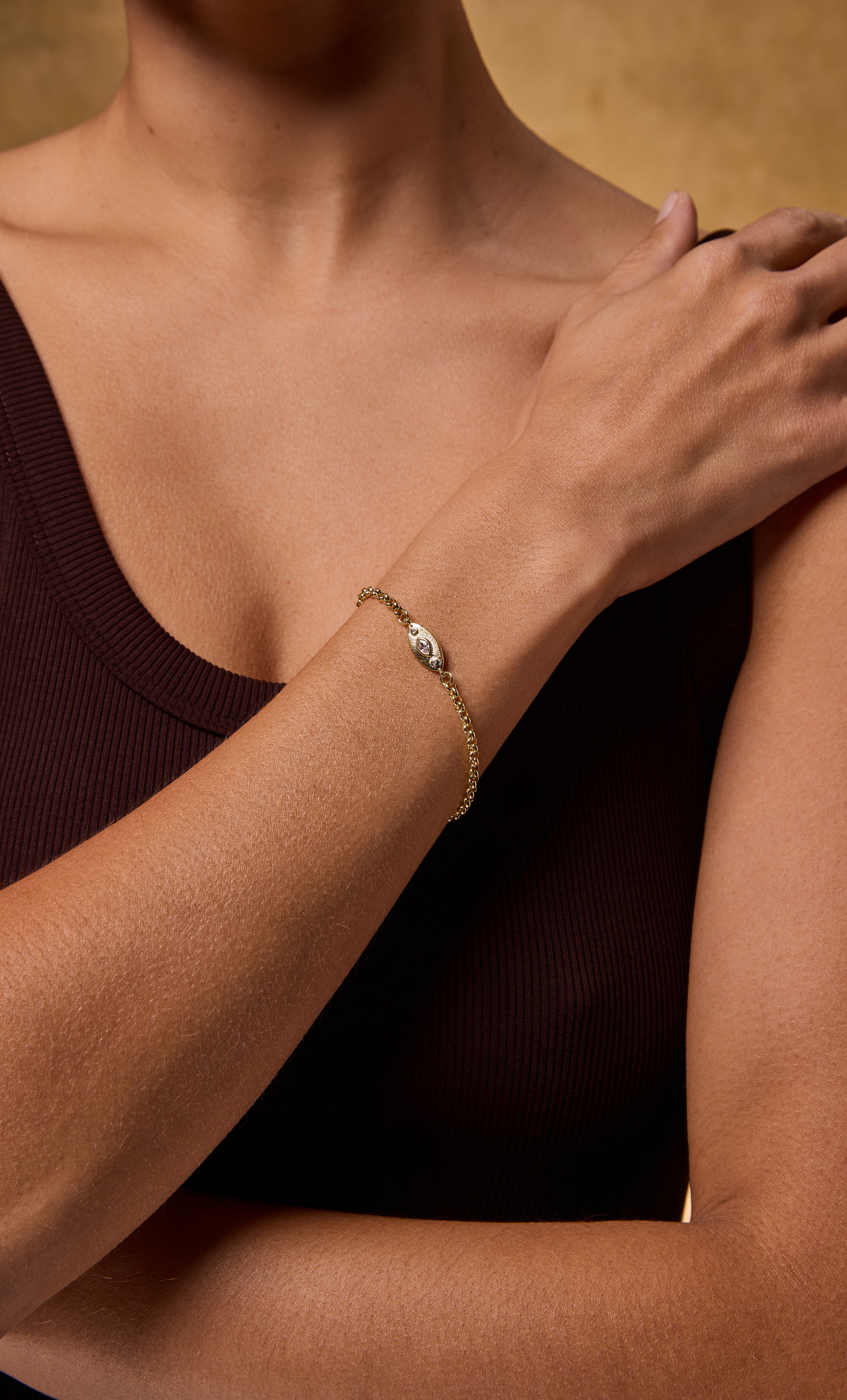 Tunik gold fill rolo chain bracelet with delicate oval charm on wrist, jewellery gift.