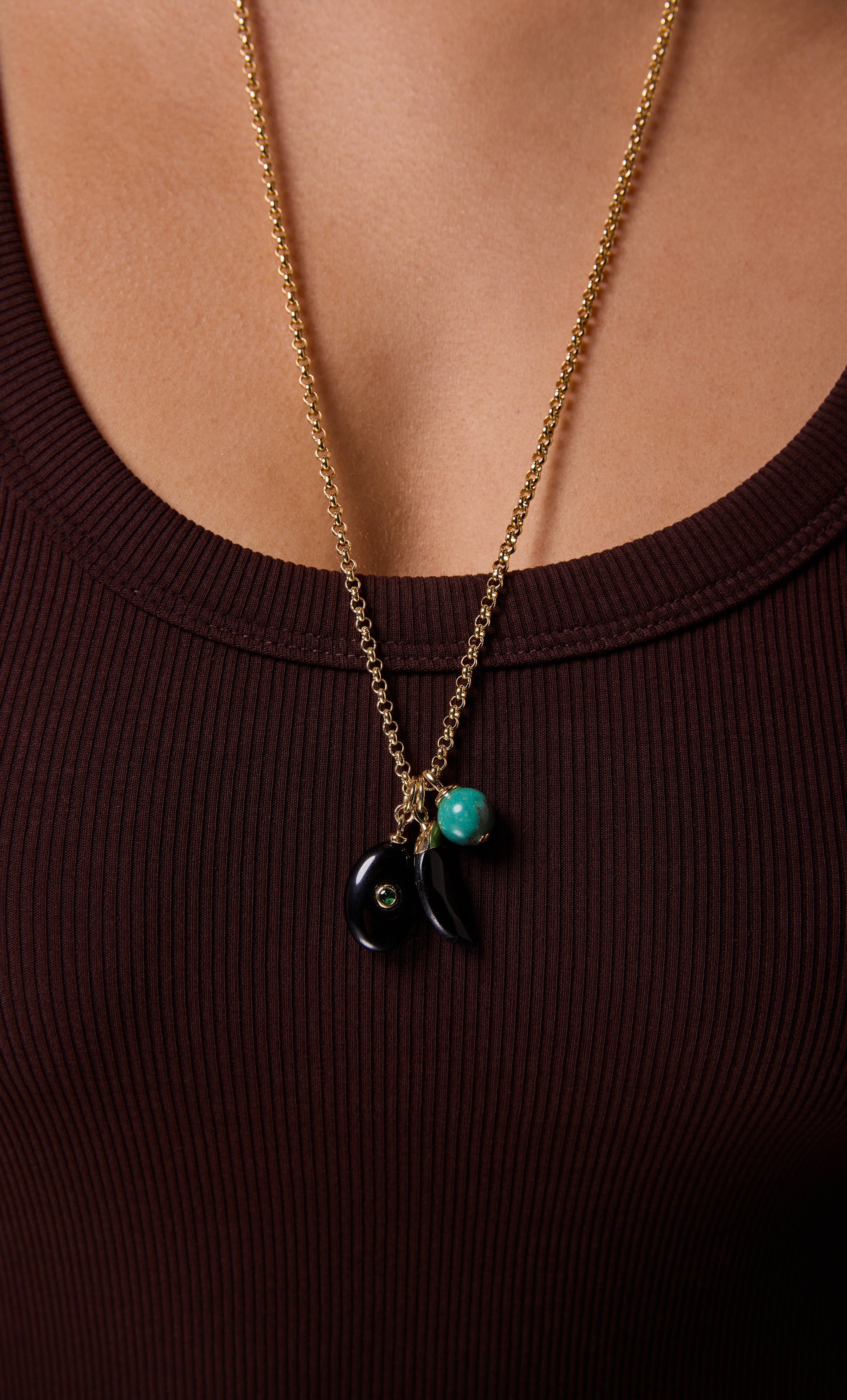 Gold fill Wanderer Trio Charm pendant necklace by Tunik the Label with black and turquoise charms on long rolo chain.