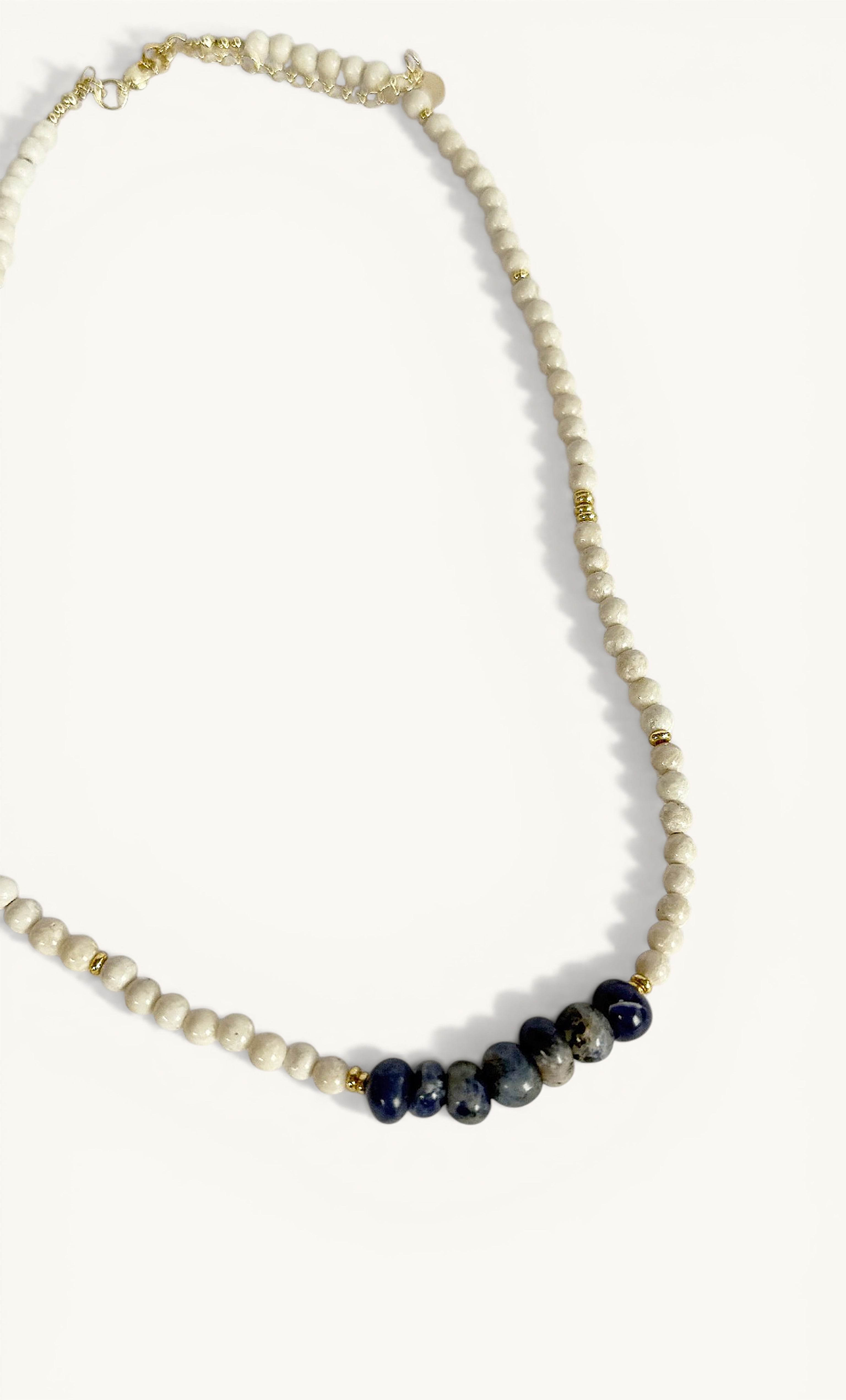 Tunik gold fill necklace featuring blue sodalite and fossil stone beads, handmade jewellery gift.
