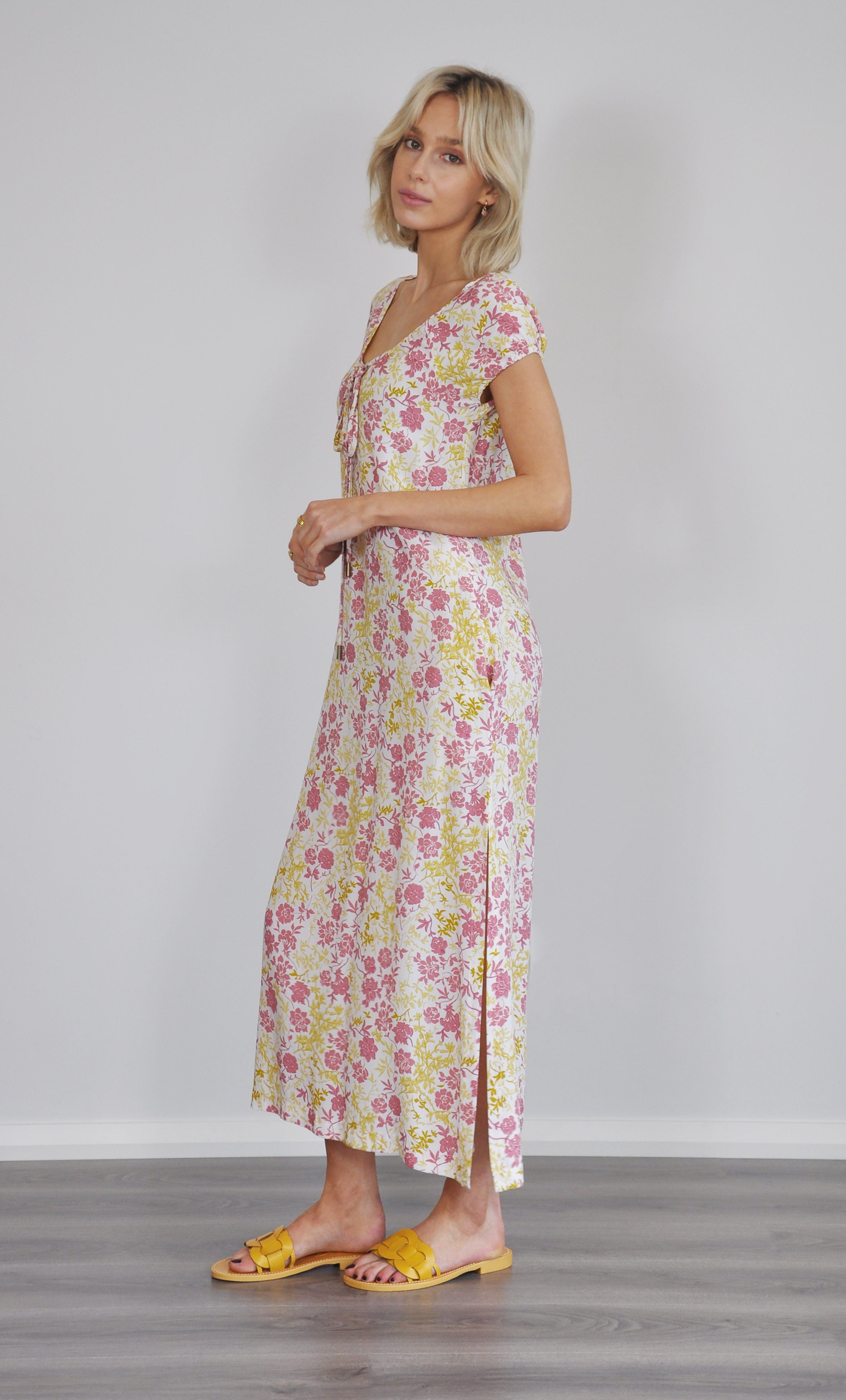 Aurelia ruffle cover up dress in floral print paired with gold fill necklace from Tunik the label, styled with yellow sandals.
