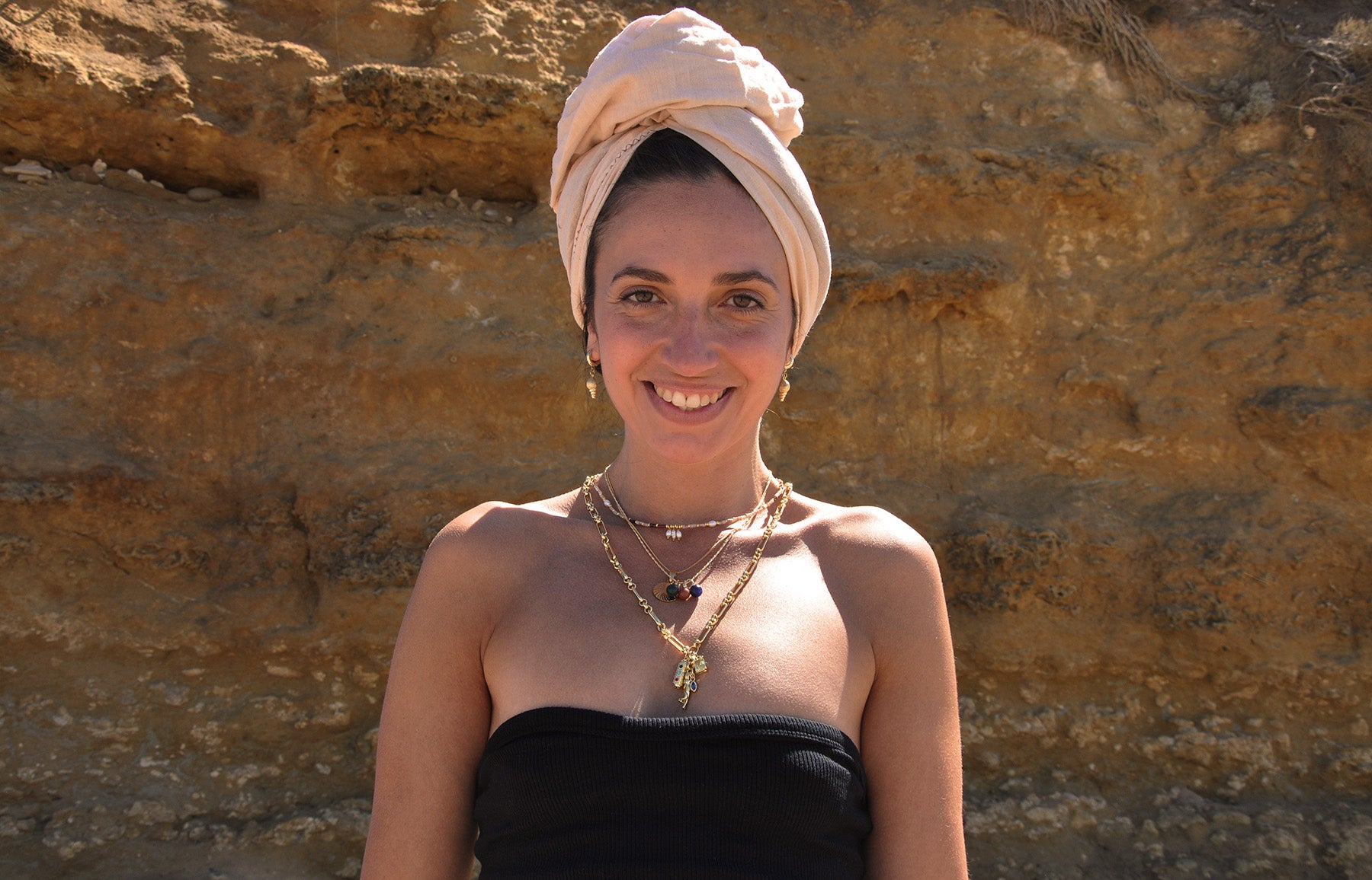 Tunik Model wearing layered Gold Fill jewellery and handmade semi precious stone jewellery