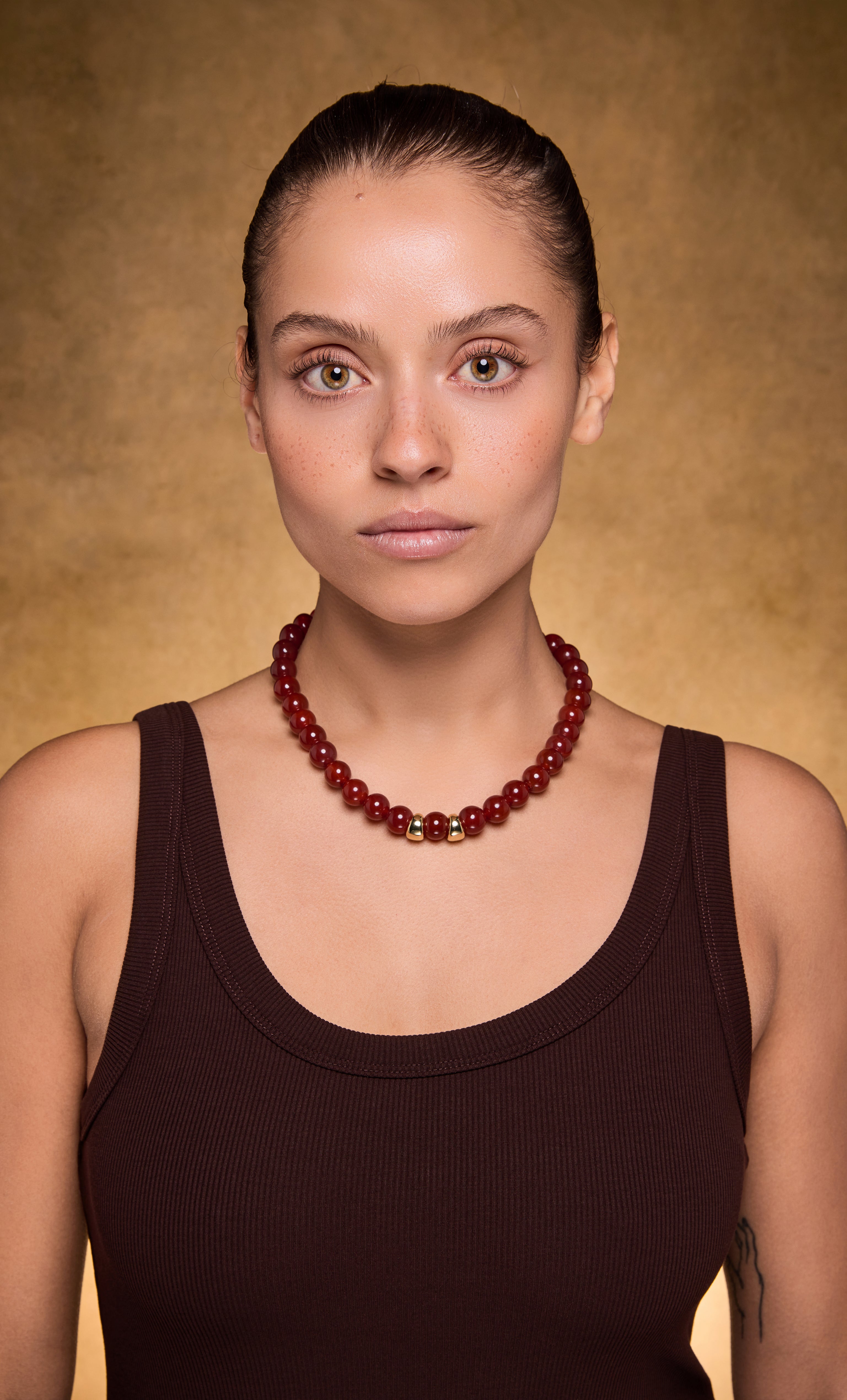 Handmade red carnelian agate stone bead necklace with polished round beads in deep red hues.