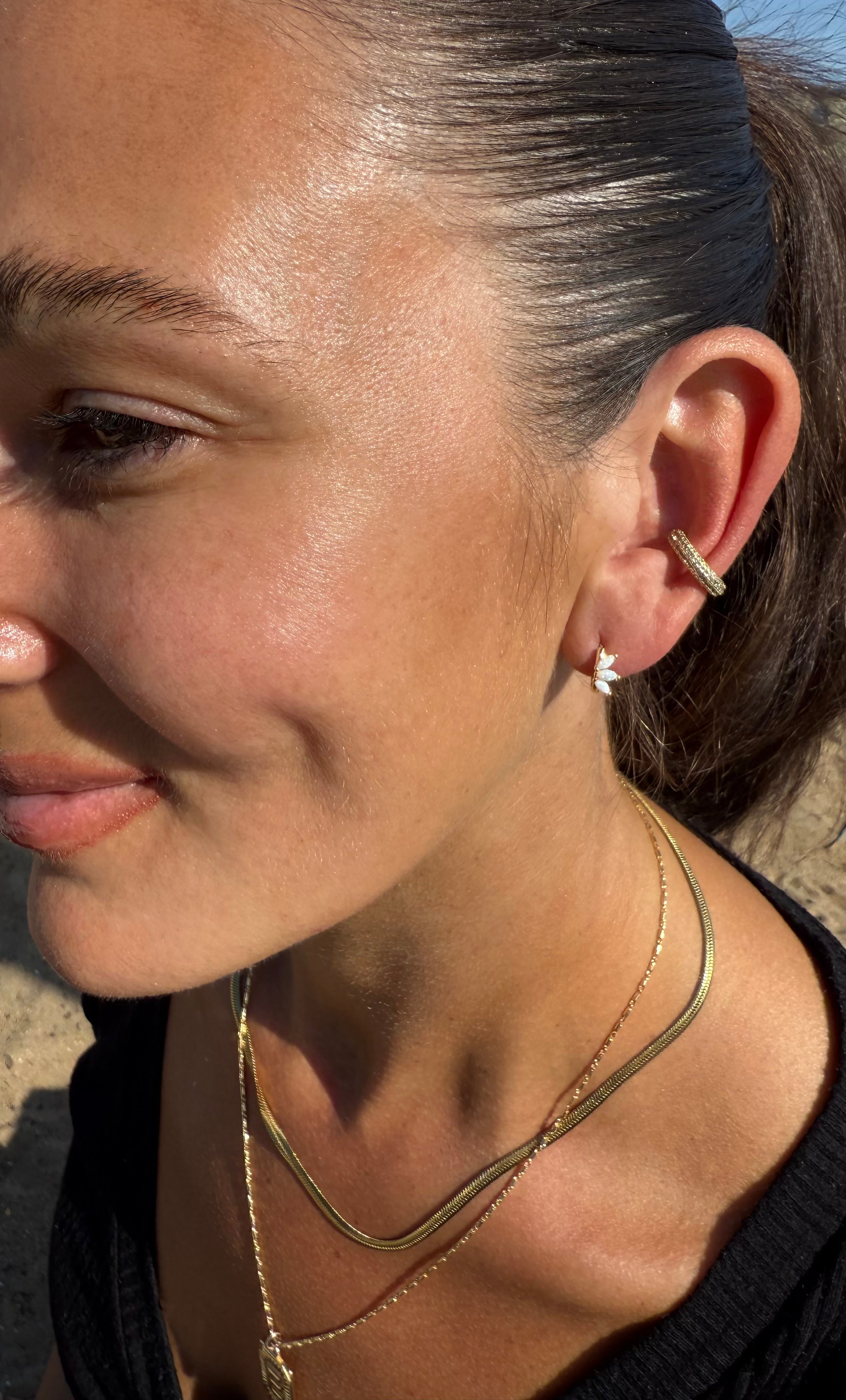 The Tunik White Opal Lumino Huggie Earrings