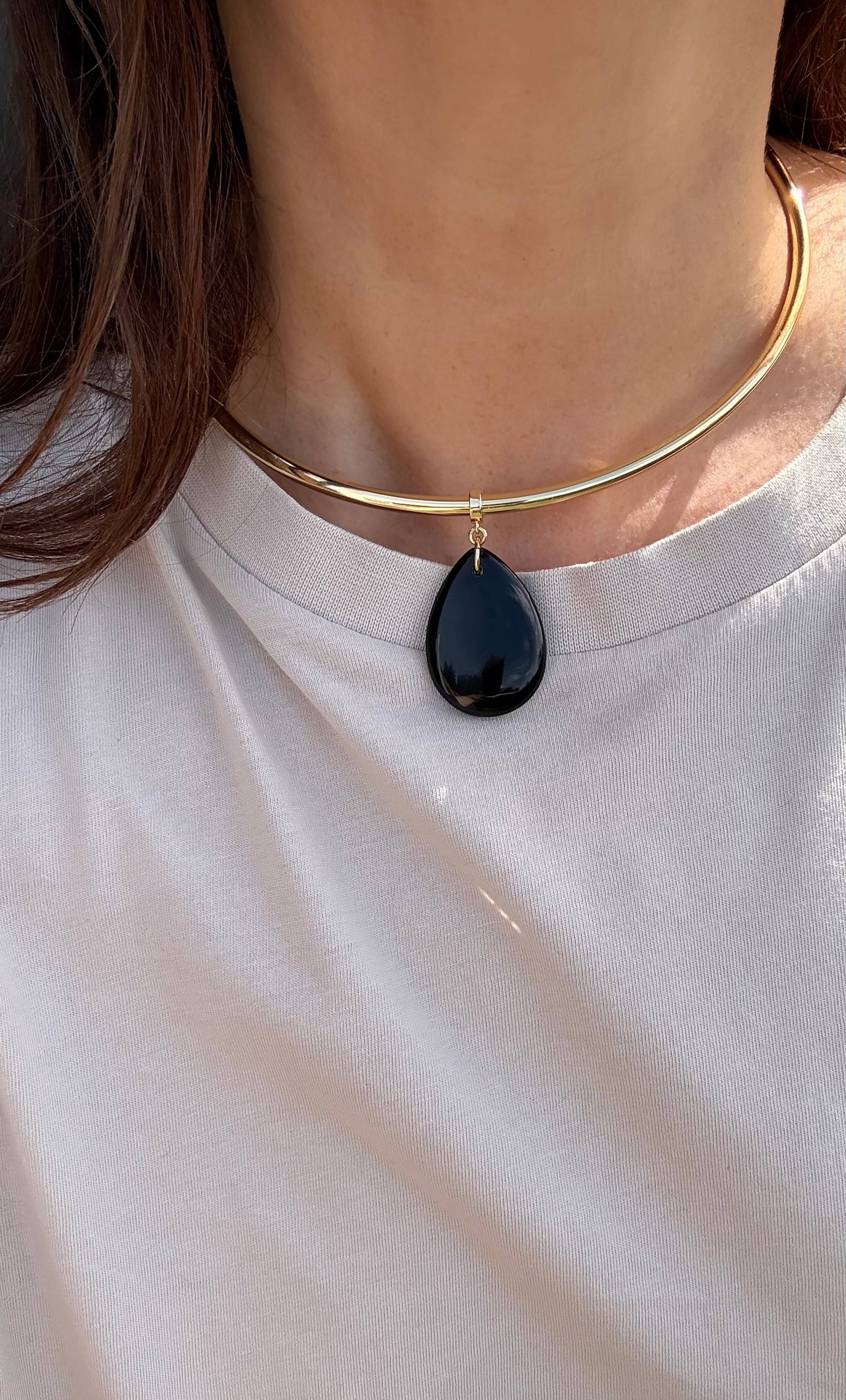 Gold fill collar necklace featuring a smooth teardrop-shaped black agate stone pendant.