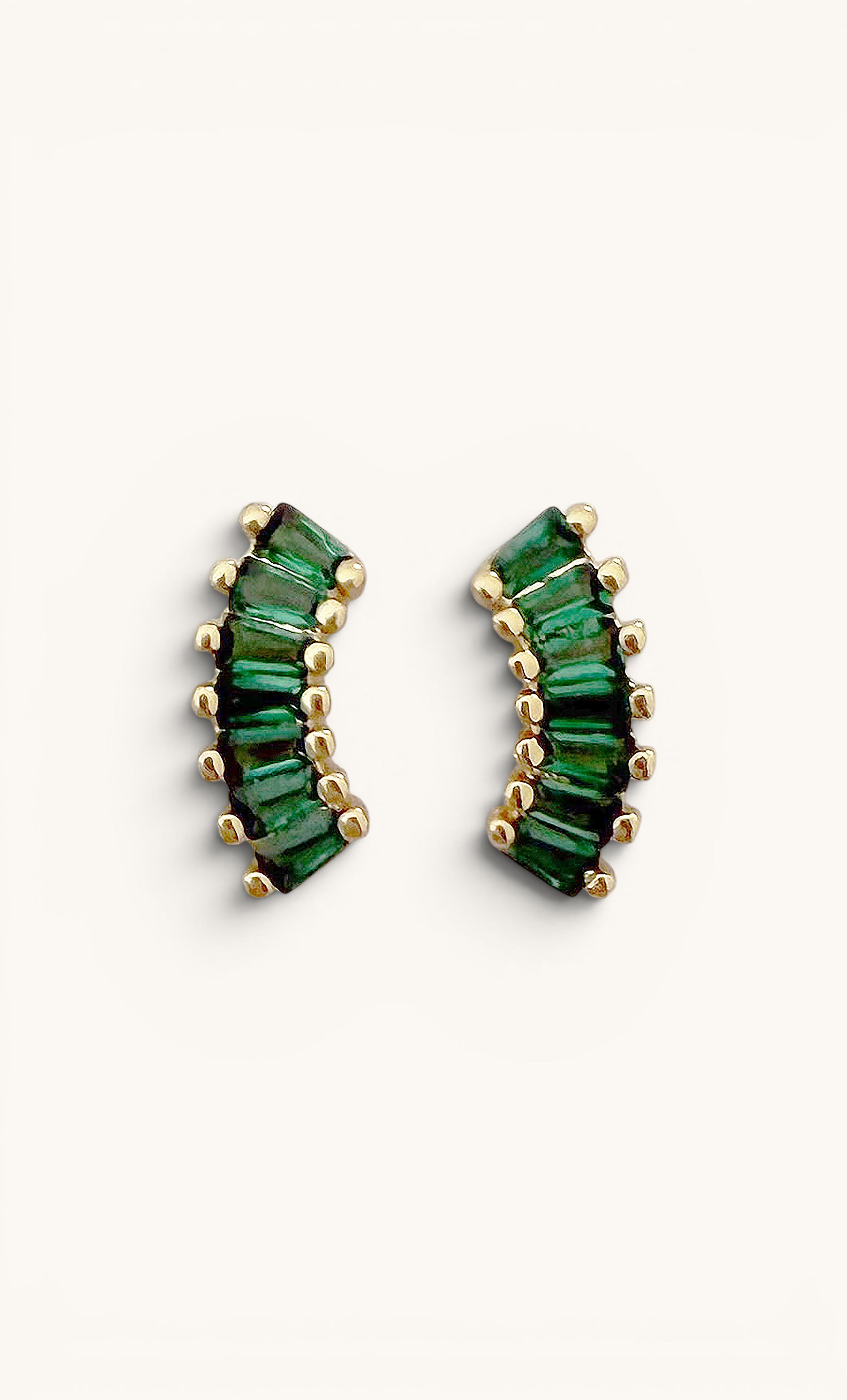 Gold fill crescent-shaped stud earrings with baguette-cut emerald green zirconia stones, Tunik jewelry style.
