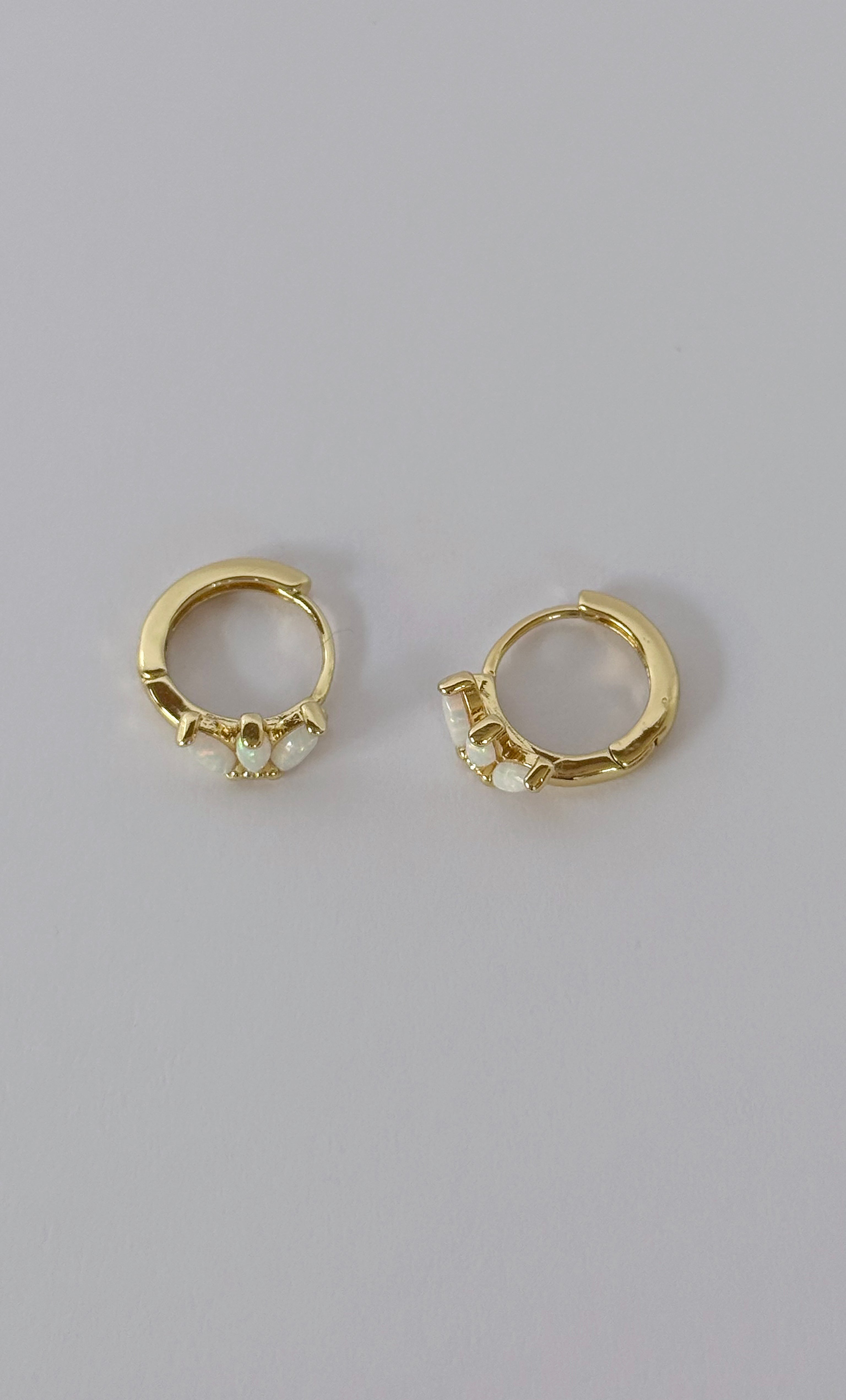 The Tunik White Opal Lumino Huggie Earrings