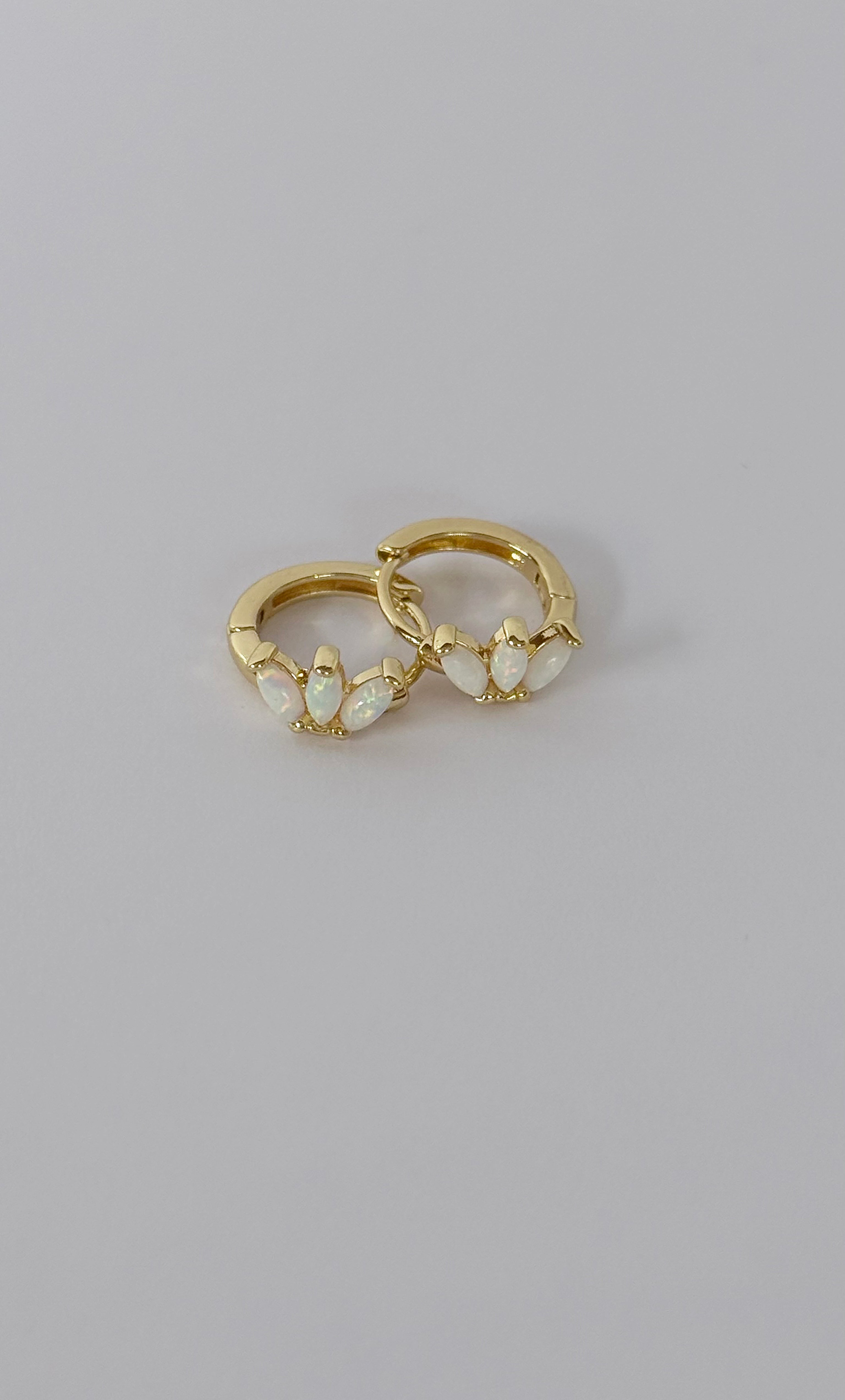 The Tunik White Opal Lumino Huggie Earrings
