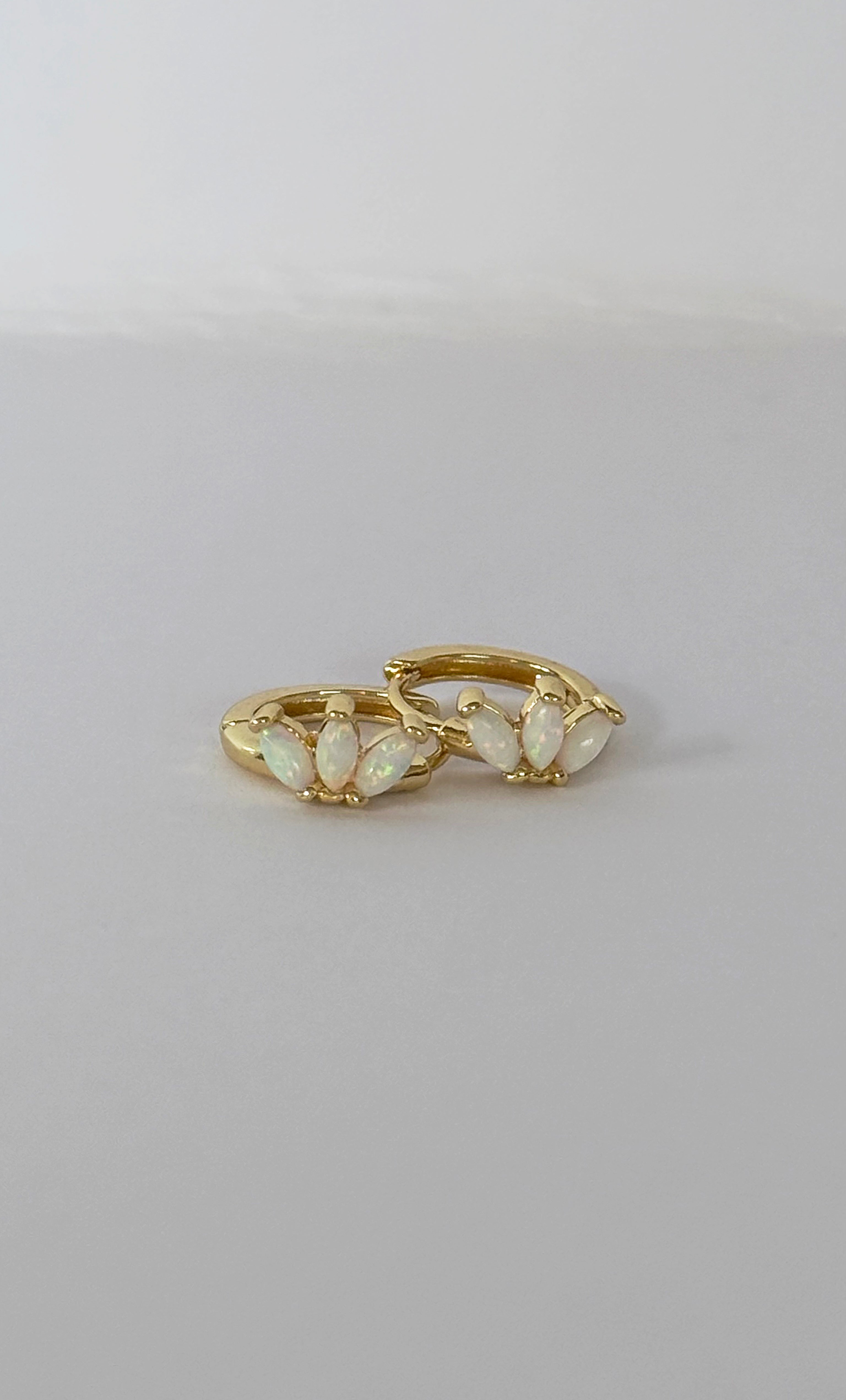 The Tunik White Opal Lumino Huggie Earrings