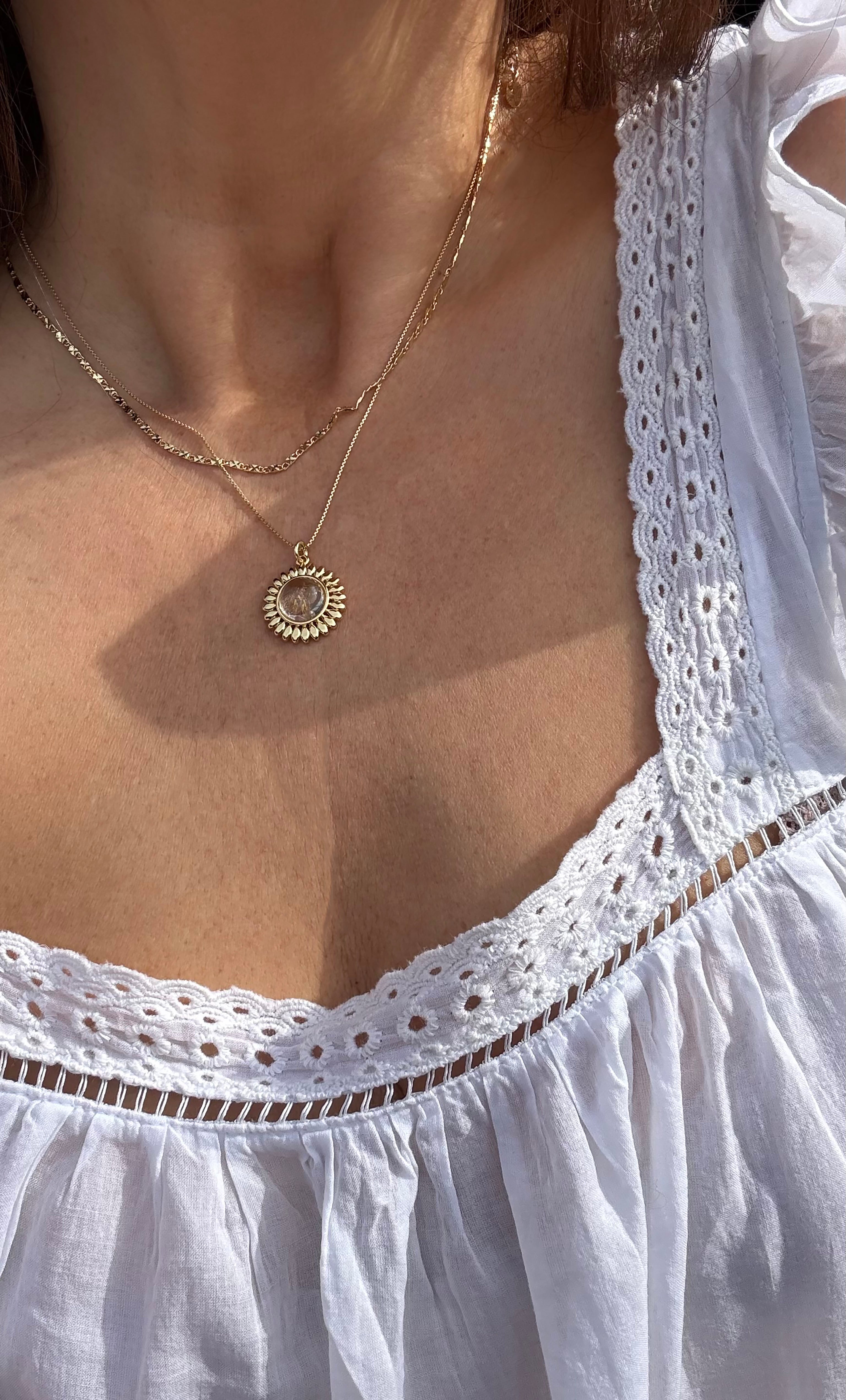 14K gold fill pendant necklace with round sun talisman and moonstone center on delicate chain.