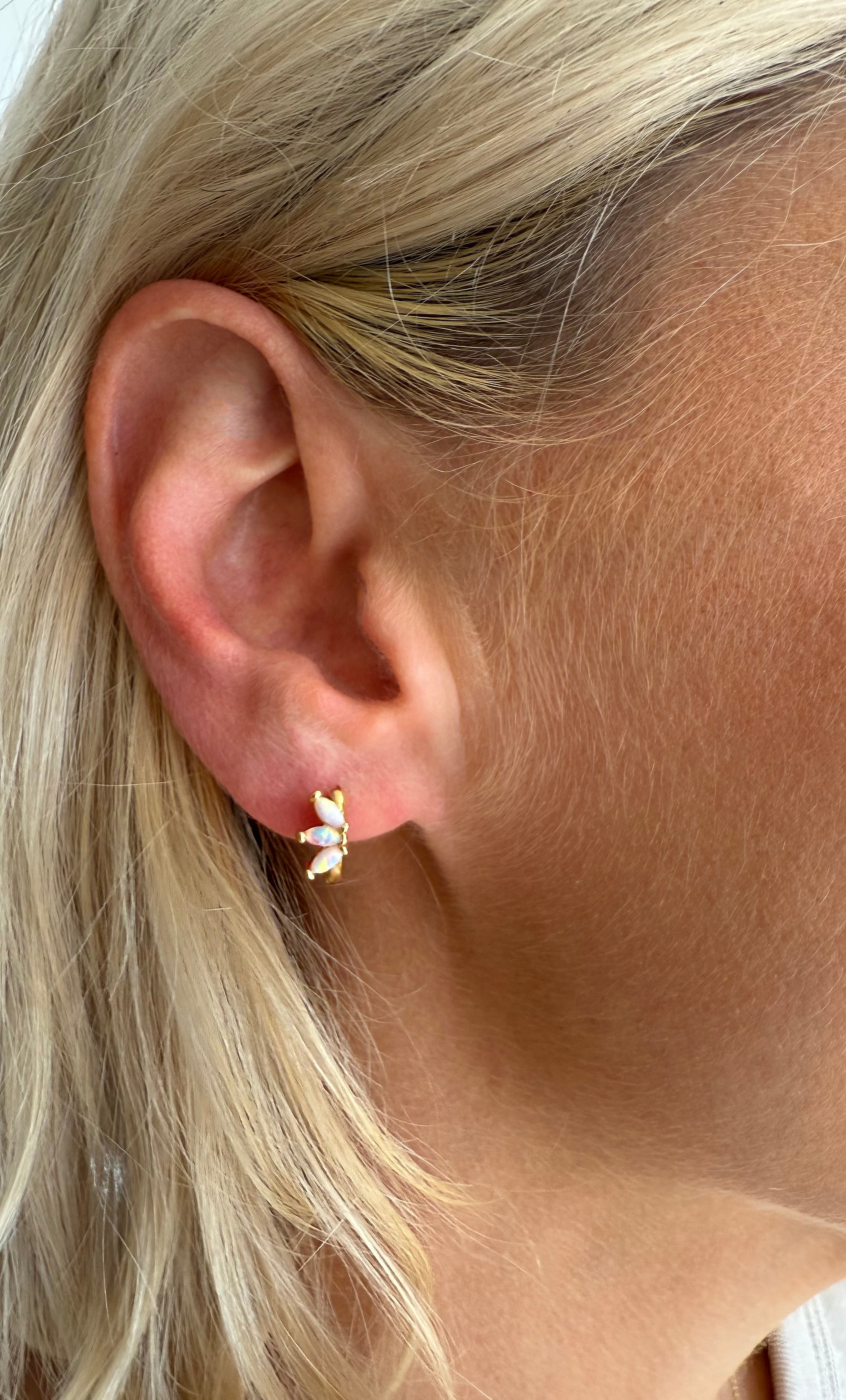 The Tunik White Opal Lumino Huggie Earrings