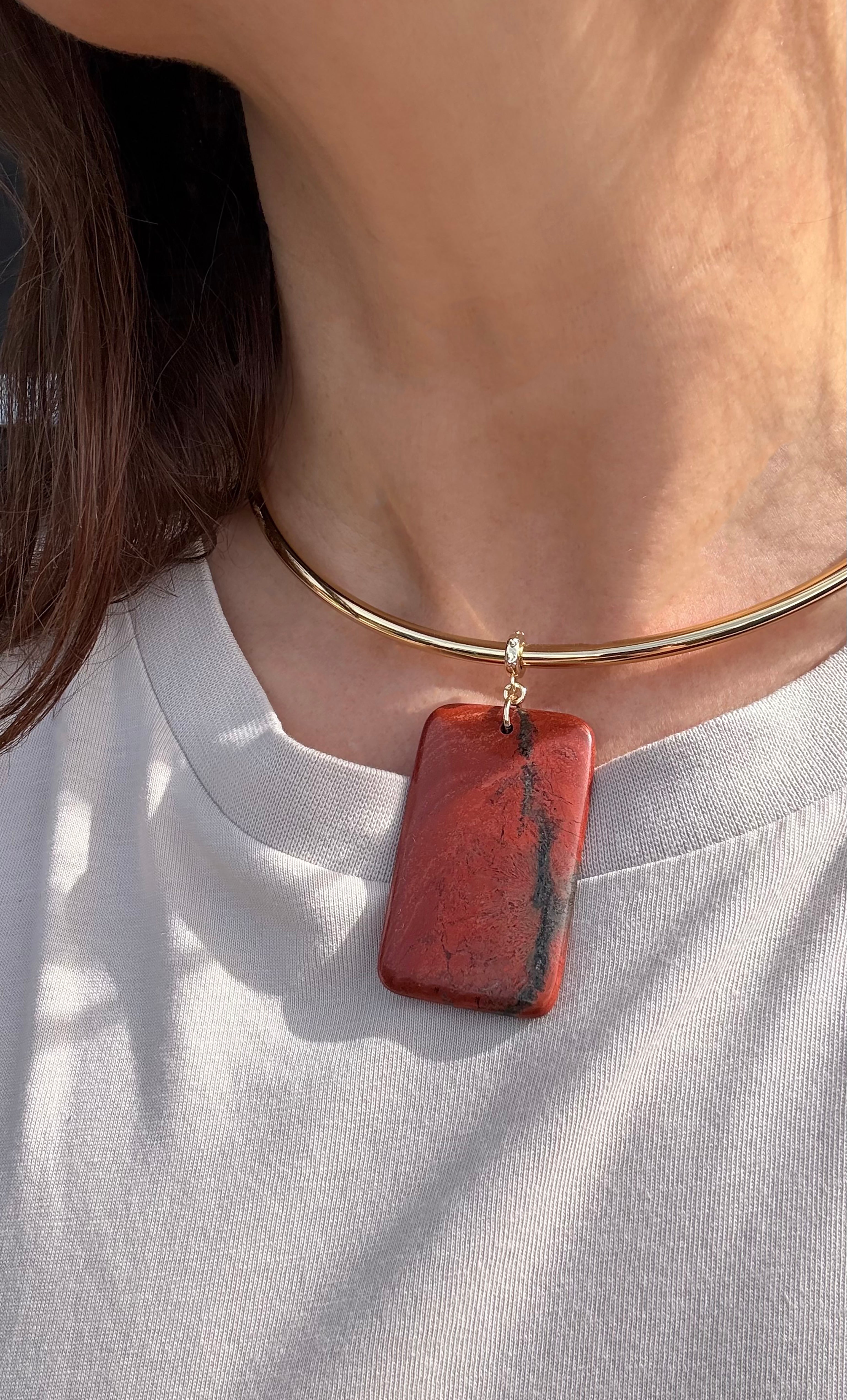 Gold fill collar necklace with a rectangular deep red jasper pendant on a sleek gold band.