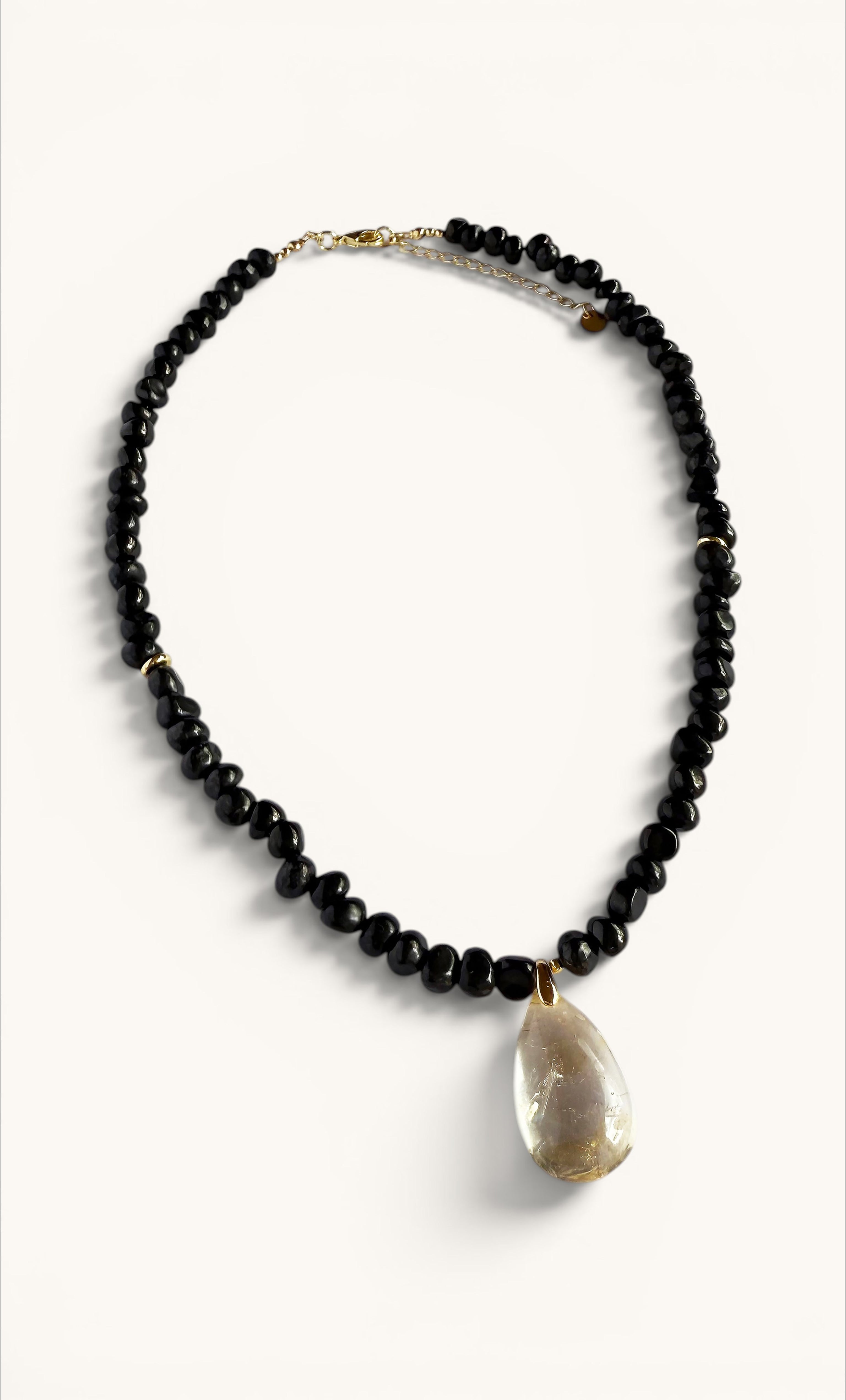 Gold-filled clasp necklace with polished black shungite beads and a large irregular citrine pendant.