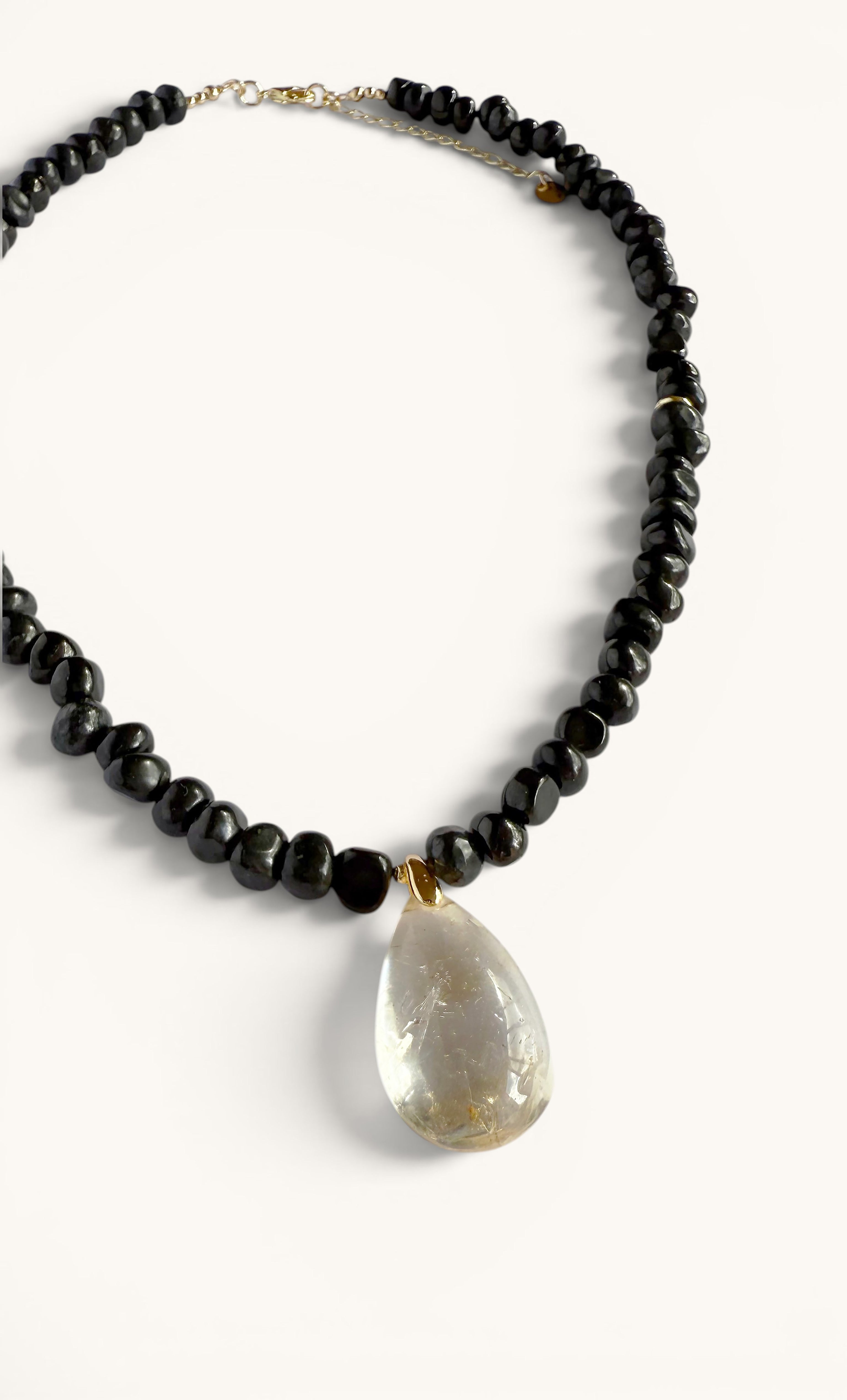 Tunik gold-fill necklace with natural black shungite pebble beads and teardrop citrine pendant.