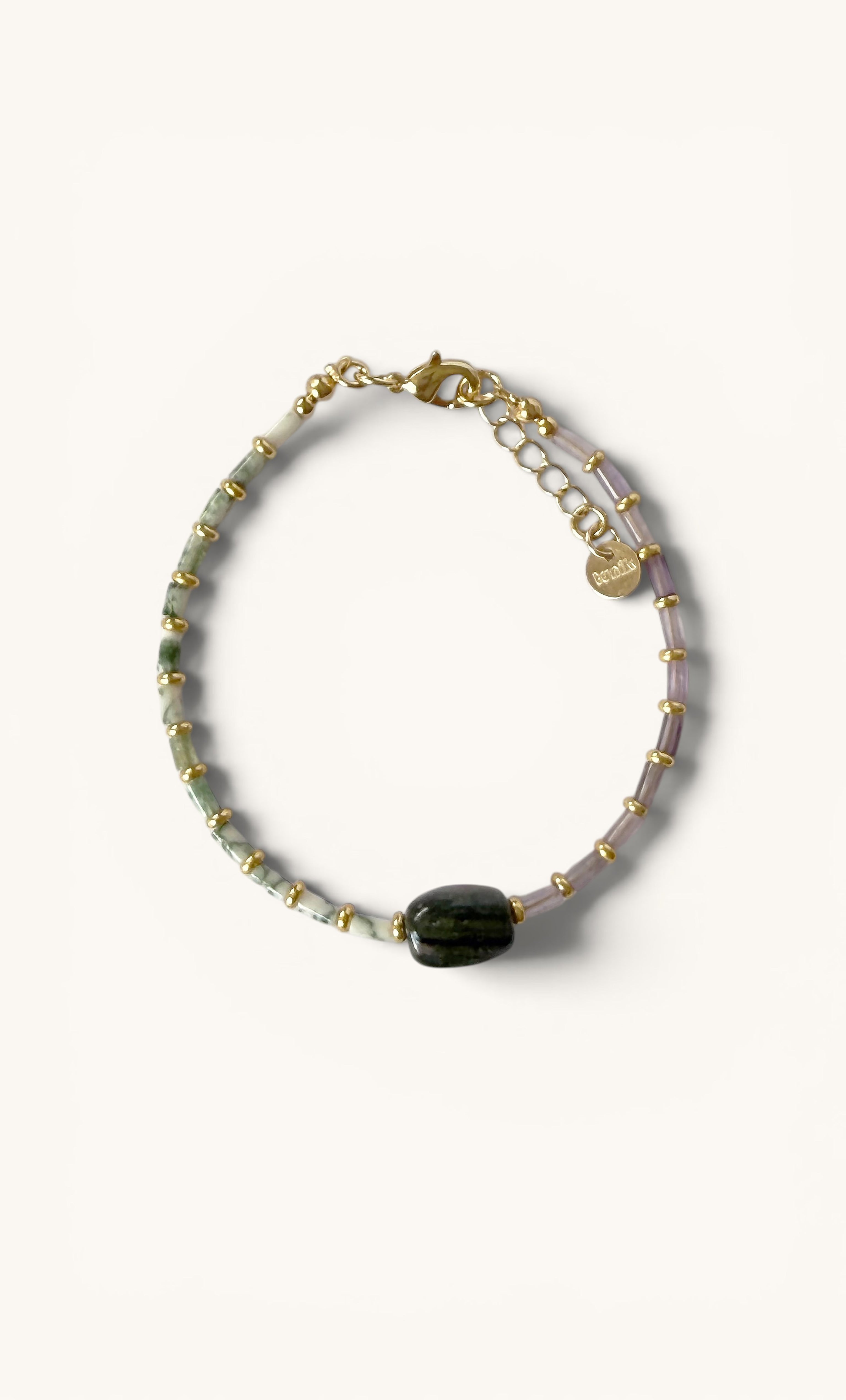 Delicate beaded bracelet with green tree agate and amethyst stones, featuring a central dark green oval bead and gold fill.