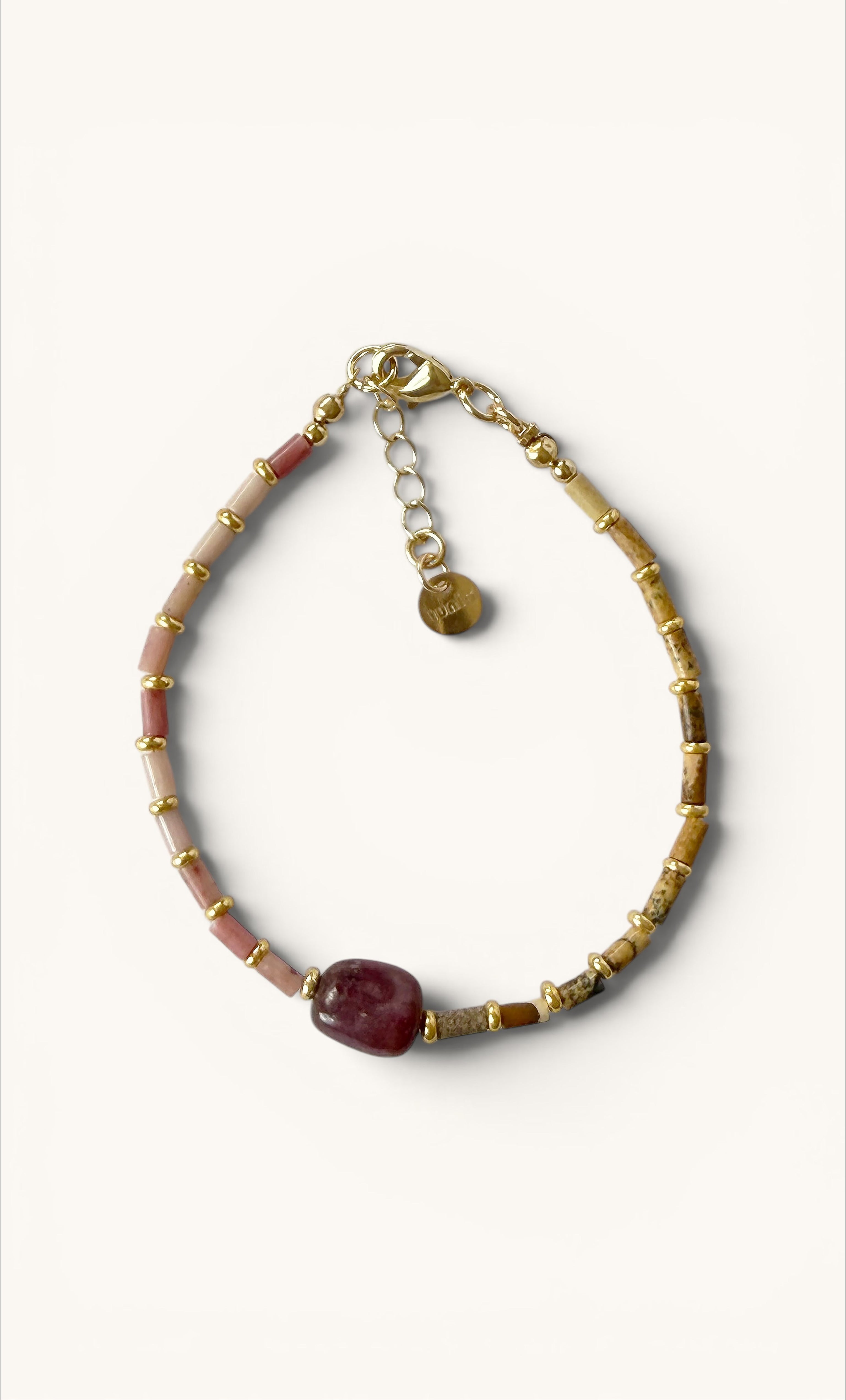 Handmade bracelet with pink rhodonite and natural jasper beads, gold-filled accents, and adjustable clasp.