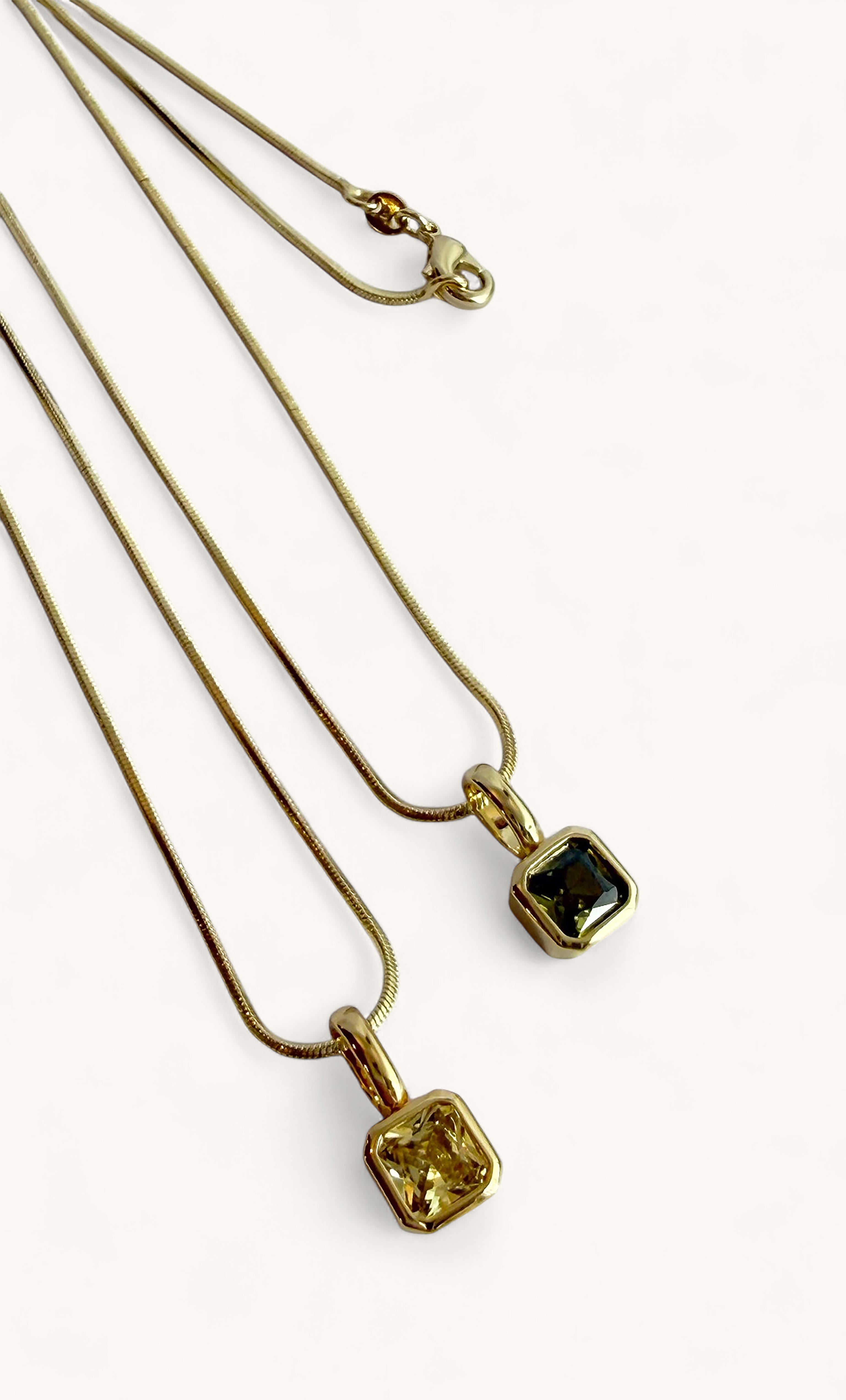 Tunik the Label gold fill snake chain necklace with square pale yellow and peridot green zirconia pendants jewelry gifts.