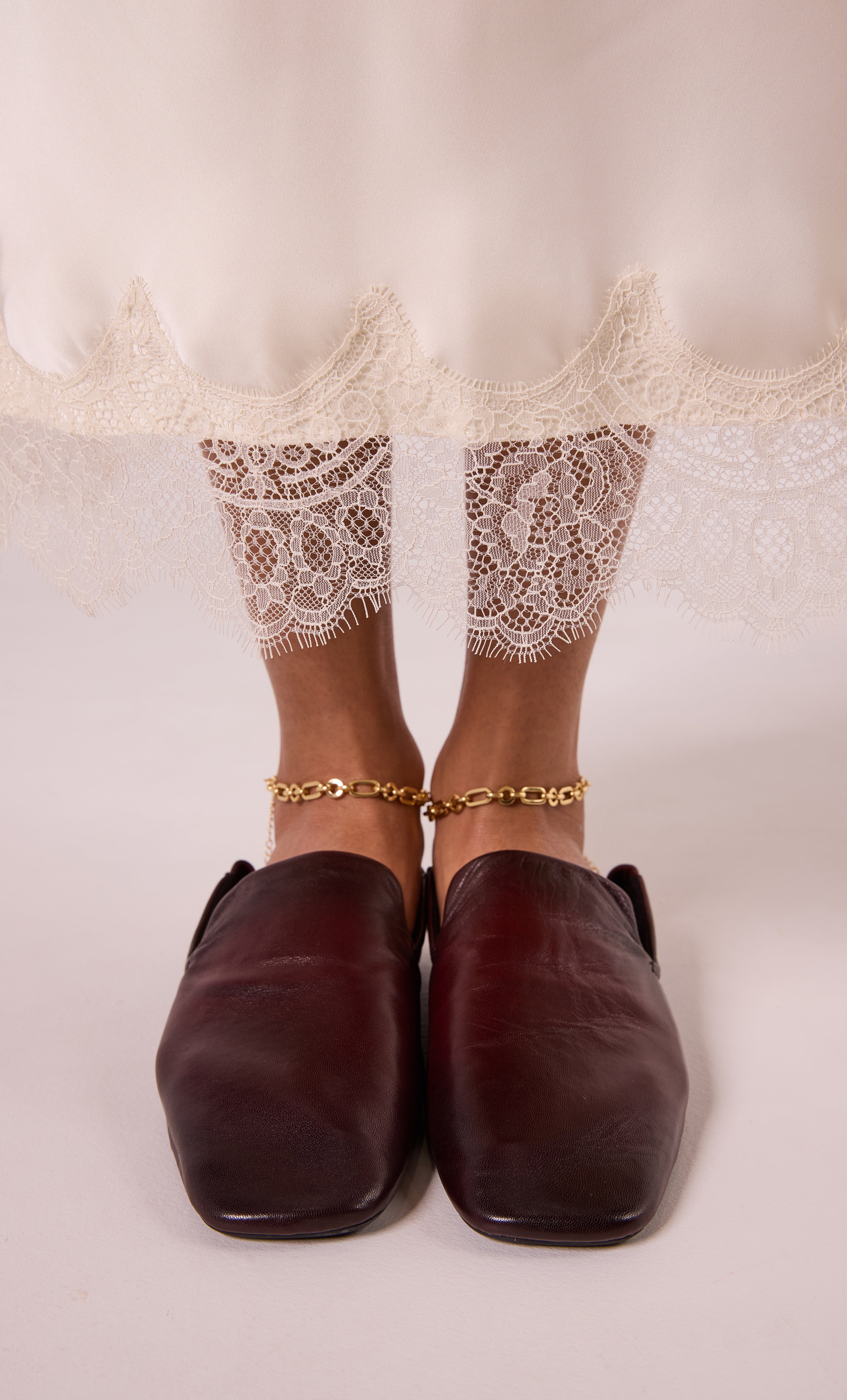24K gold fill thick paper clip chain anklet by Tunik paired with lace-trimmed dress and brown leather shoes.