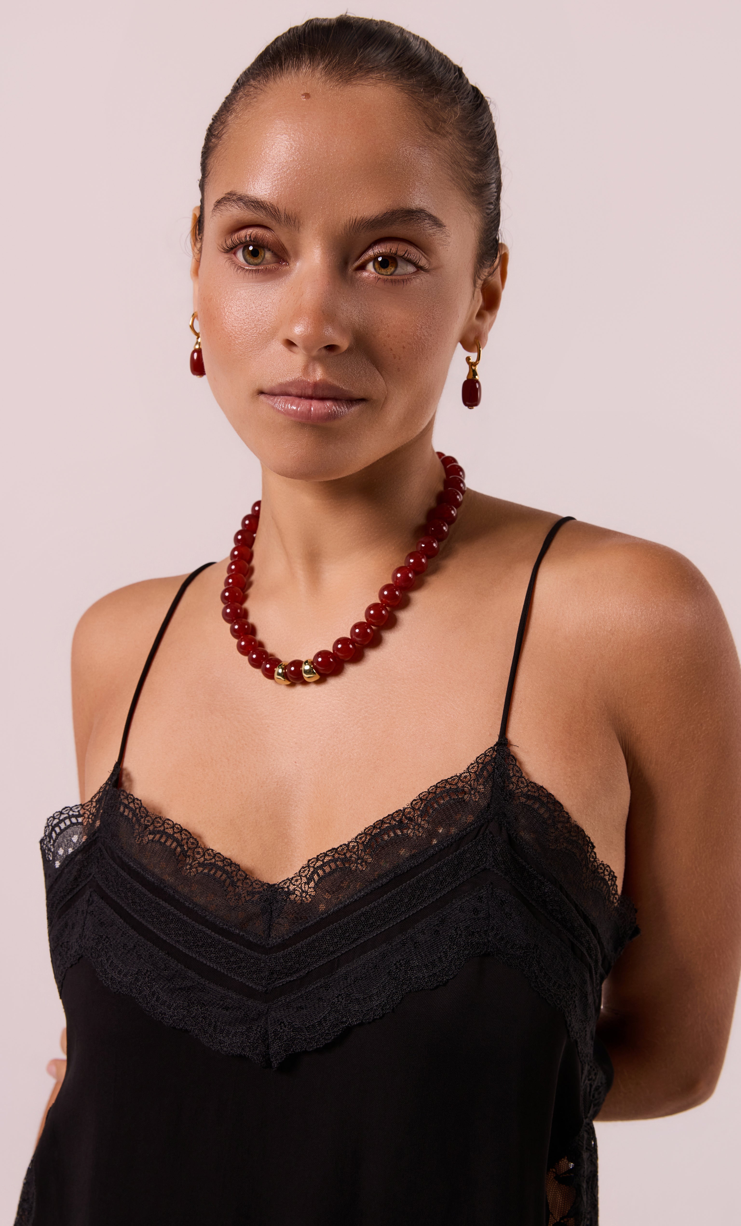 18K gold fill hoop earrings with carnelian red stone drops by Tunik, paired with matching carnelian necklace, elegant.