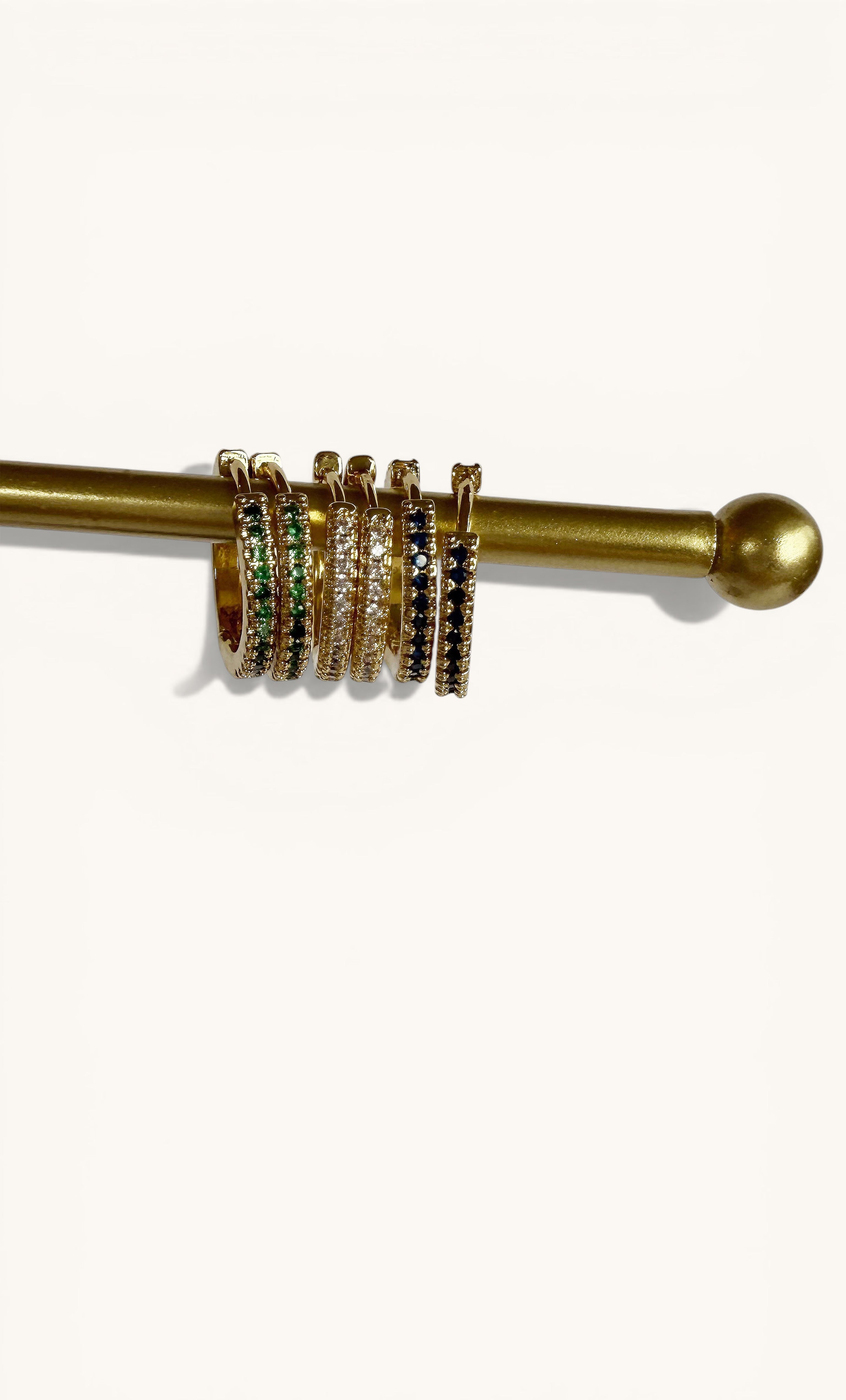 Gaia 24K gold fill zirconia stone huggie earrings in sapphire, emerald, and clear by Tunik jewelry gifts.