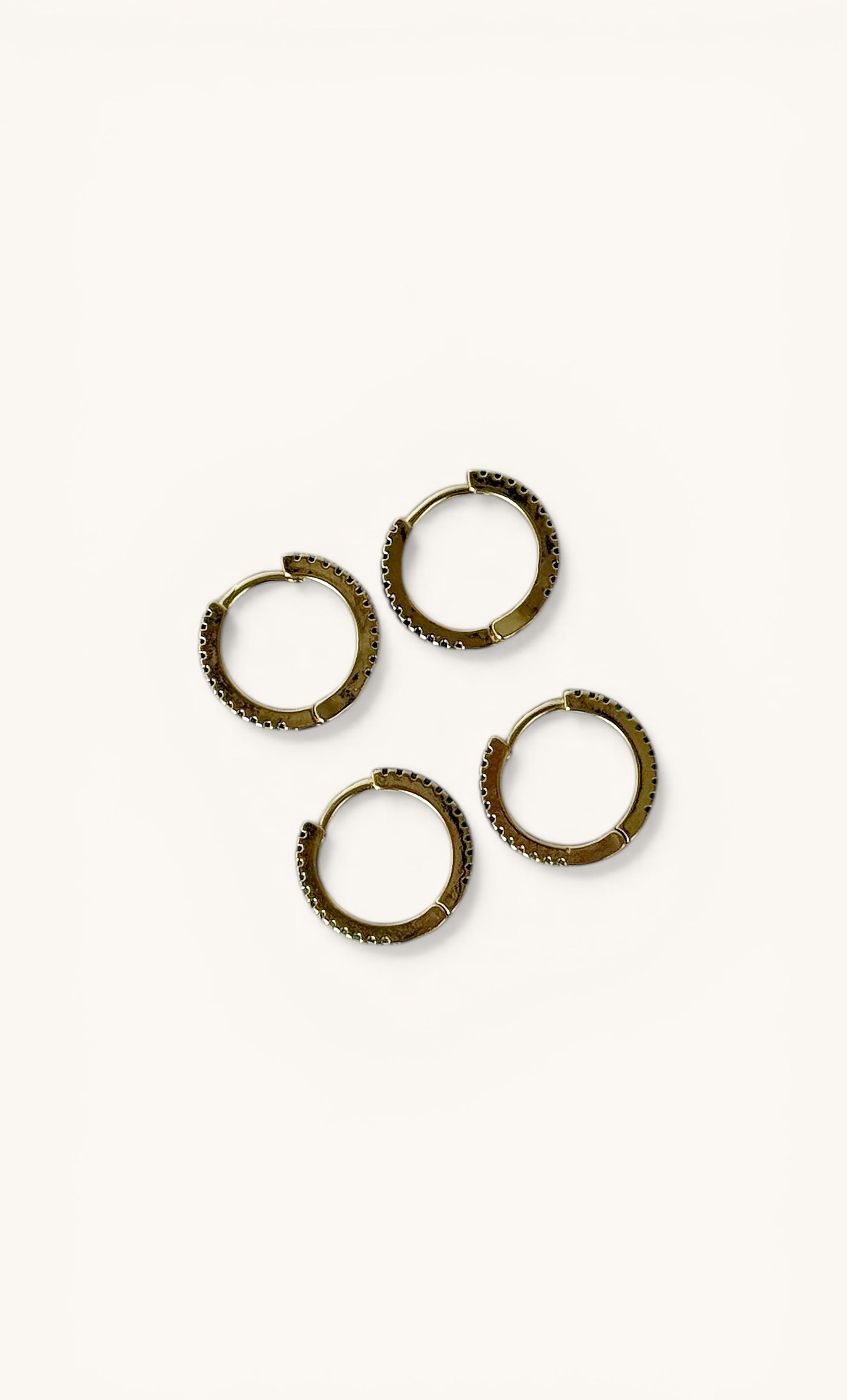 Set of four Gaia 24K gold fill huggie earrings by Tunik with clear zirconia stones, elegant jewellery gifts.