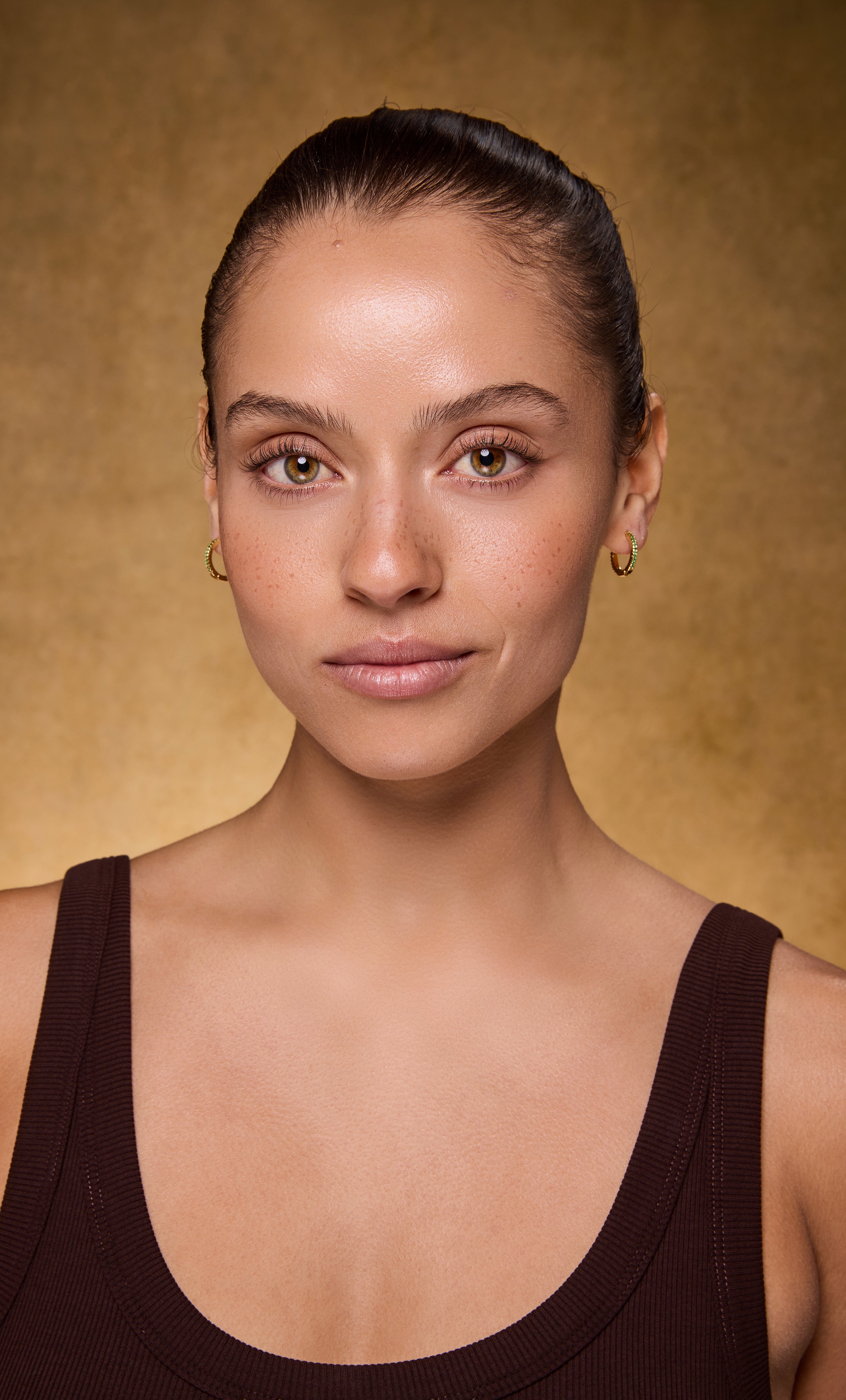 Gaia 24K gold fill huggie earrings with clear zirconia stones from Tunik jewellery collection.