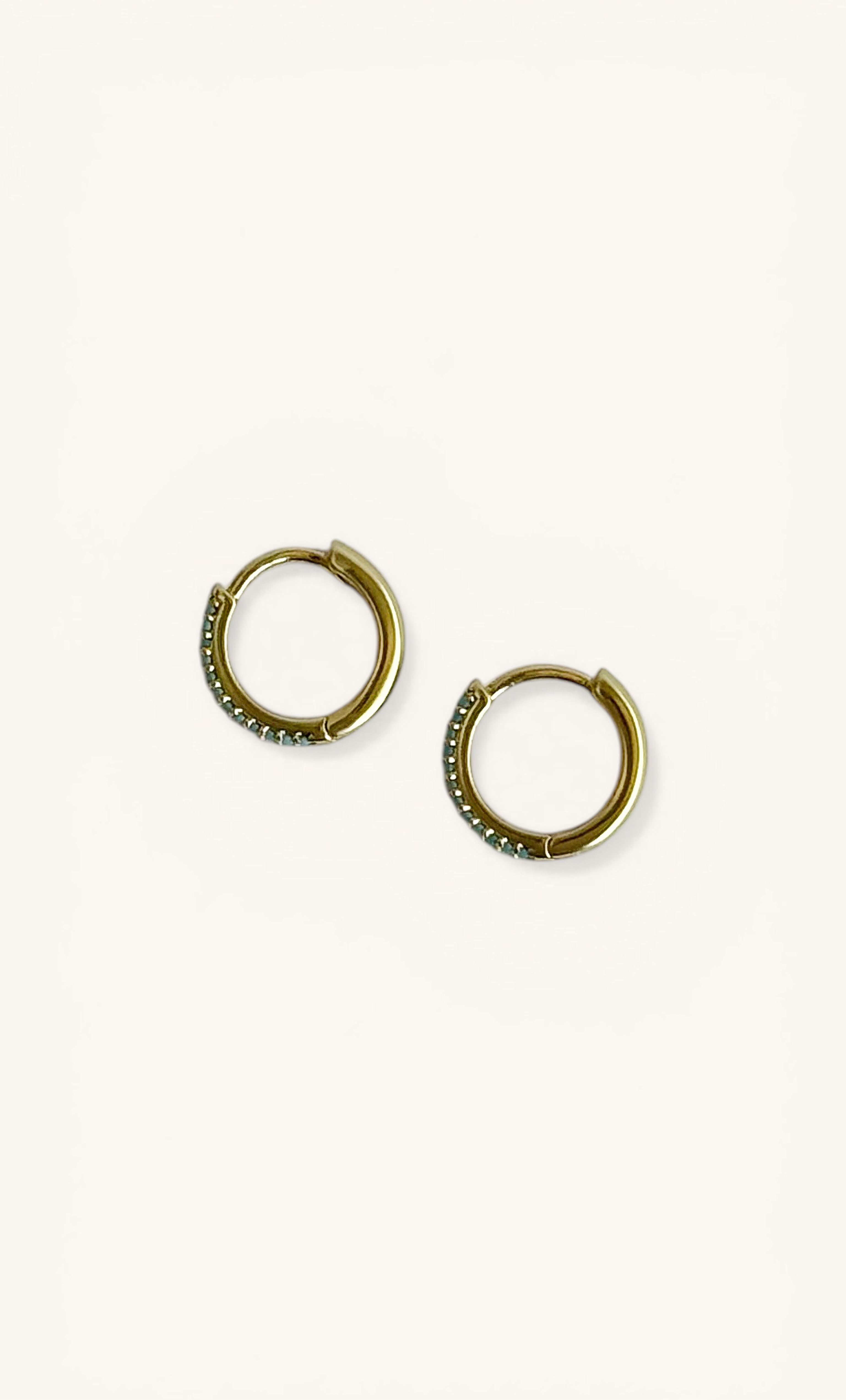 Gold fill huggie earrings with turquoise zirconia stones from Tunik jewellery gifts.