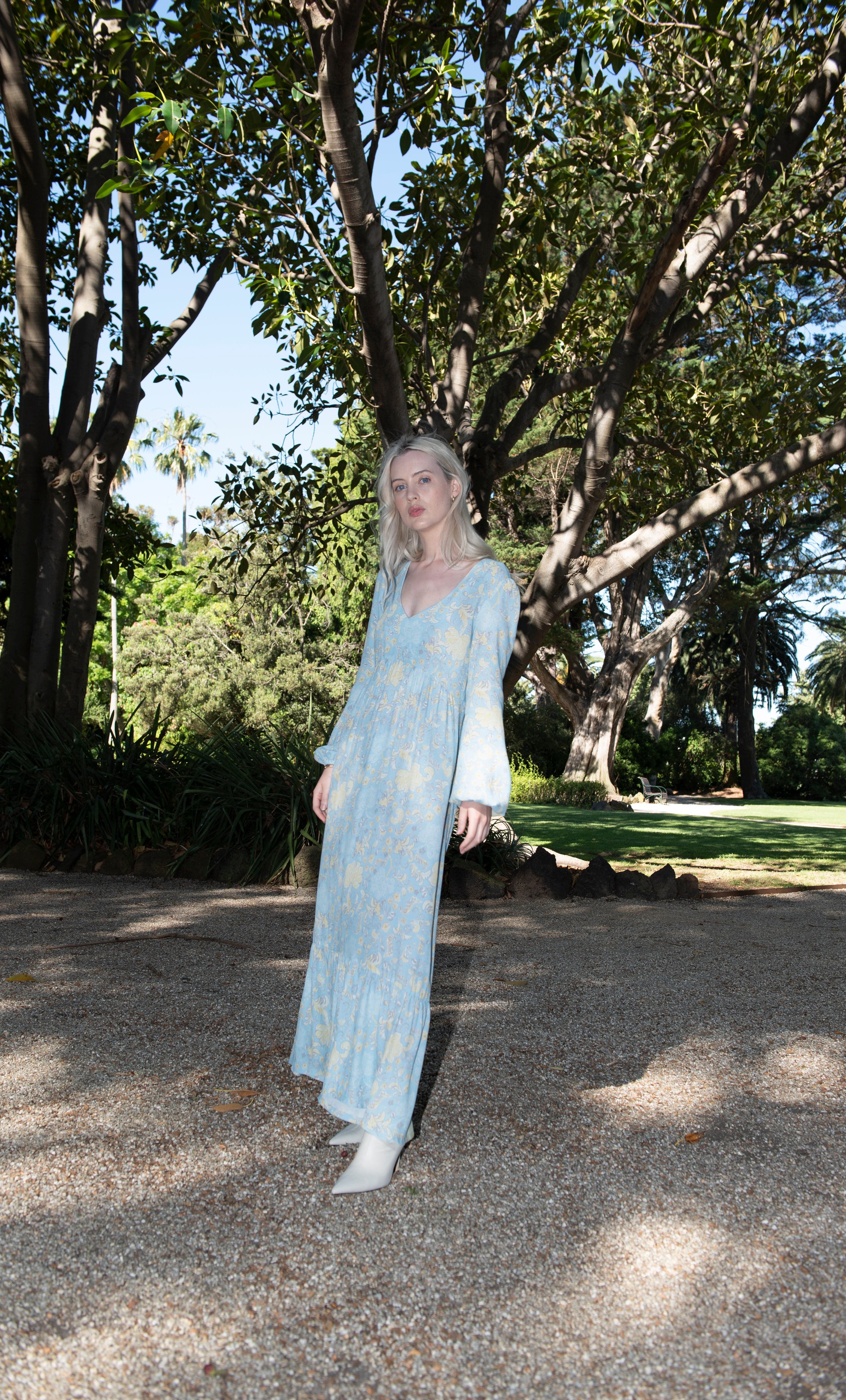 Tunik Lola maxi dress in Mystic Floral Aquamarine print paired with gold fill necklace from Tunik the Label.